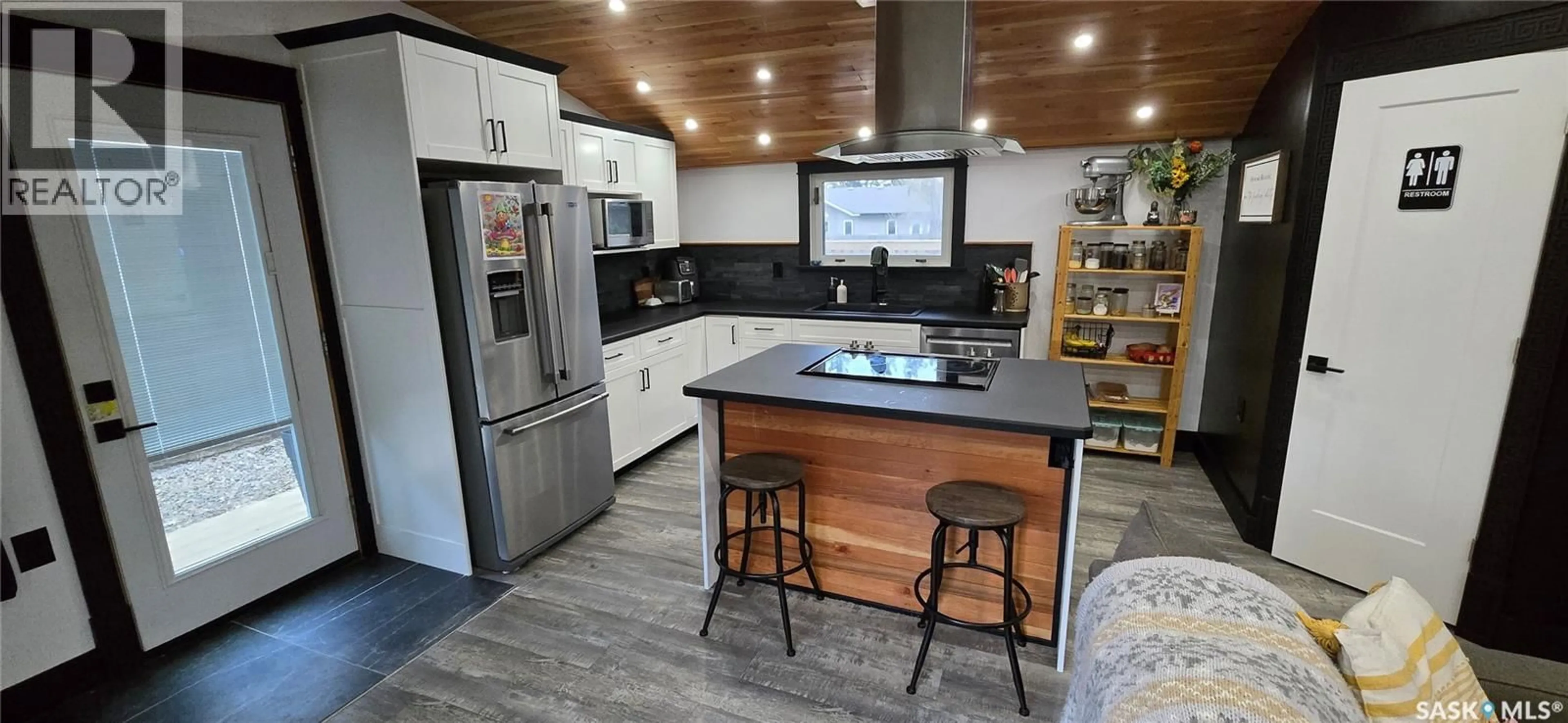 Open concept kitchen, wood/laminate floor for 34 OKADOCA STREET, Kenosee Lake Saskatchewan S0C2S0
