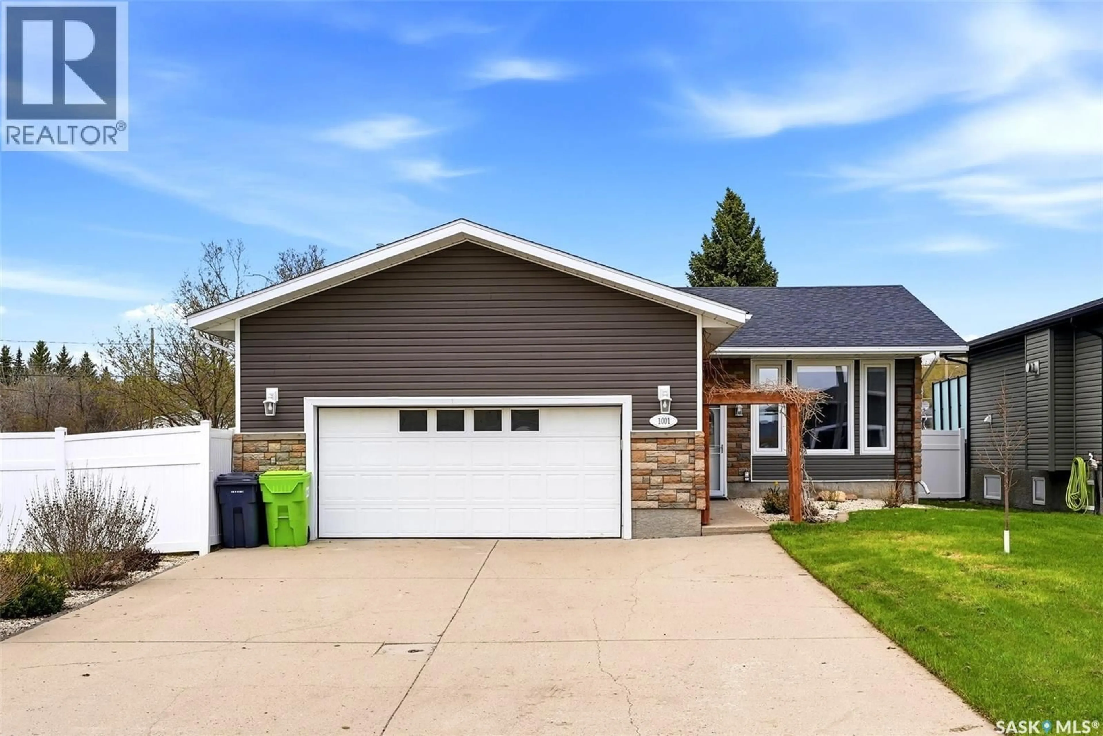 Home with vinyl exterior material, street for 1001 DEWDNEY STREET, Indian Head Saskatchewan S0G2K0