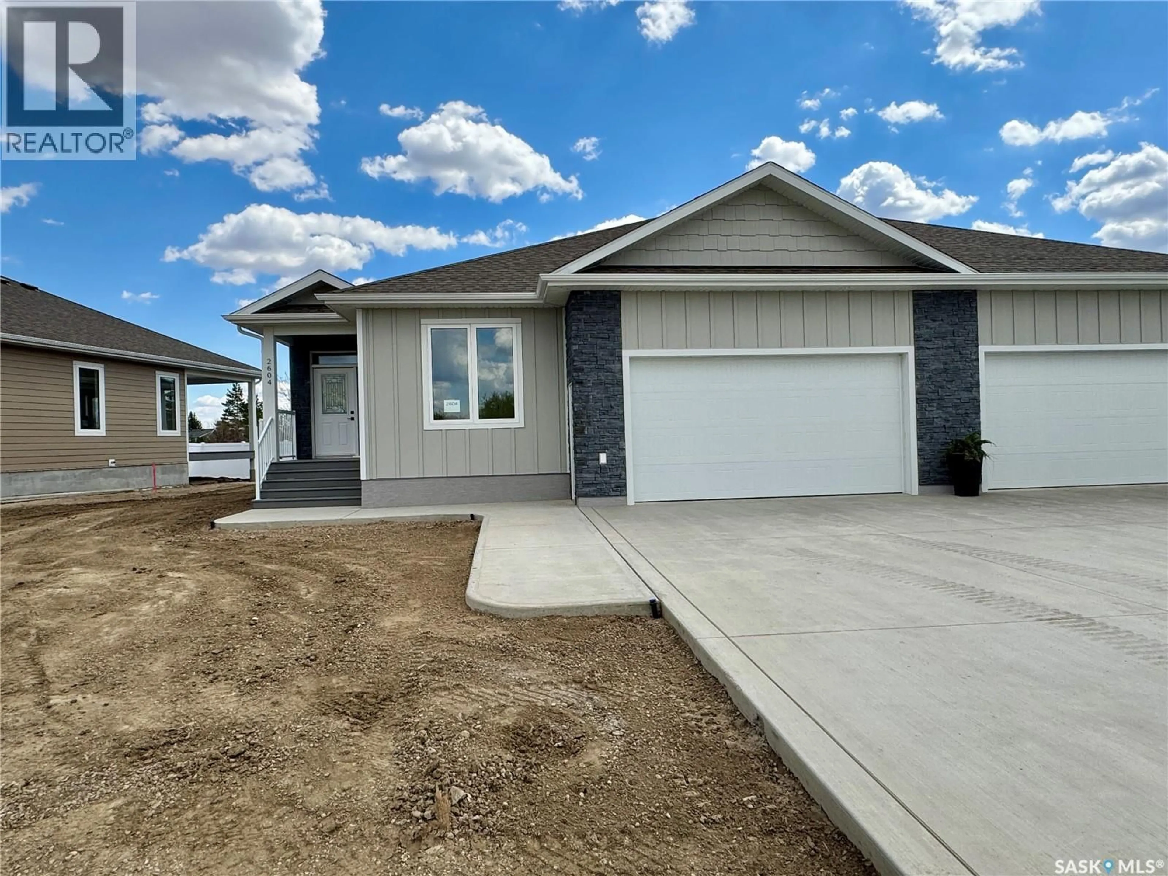 Home with vinyl exterior material, street for 2604 SANDPIPER ROAD, North Battleford Saskatchewan S9A3Z3