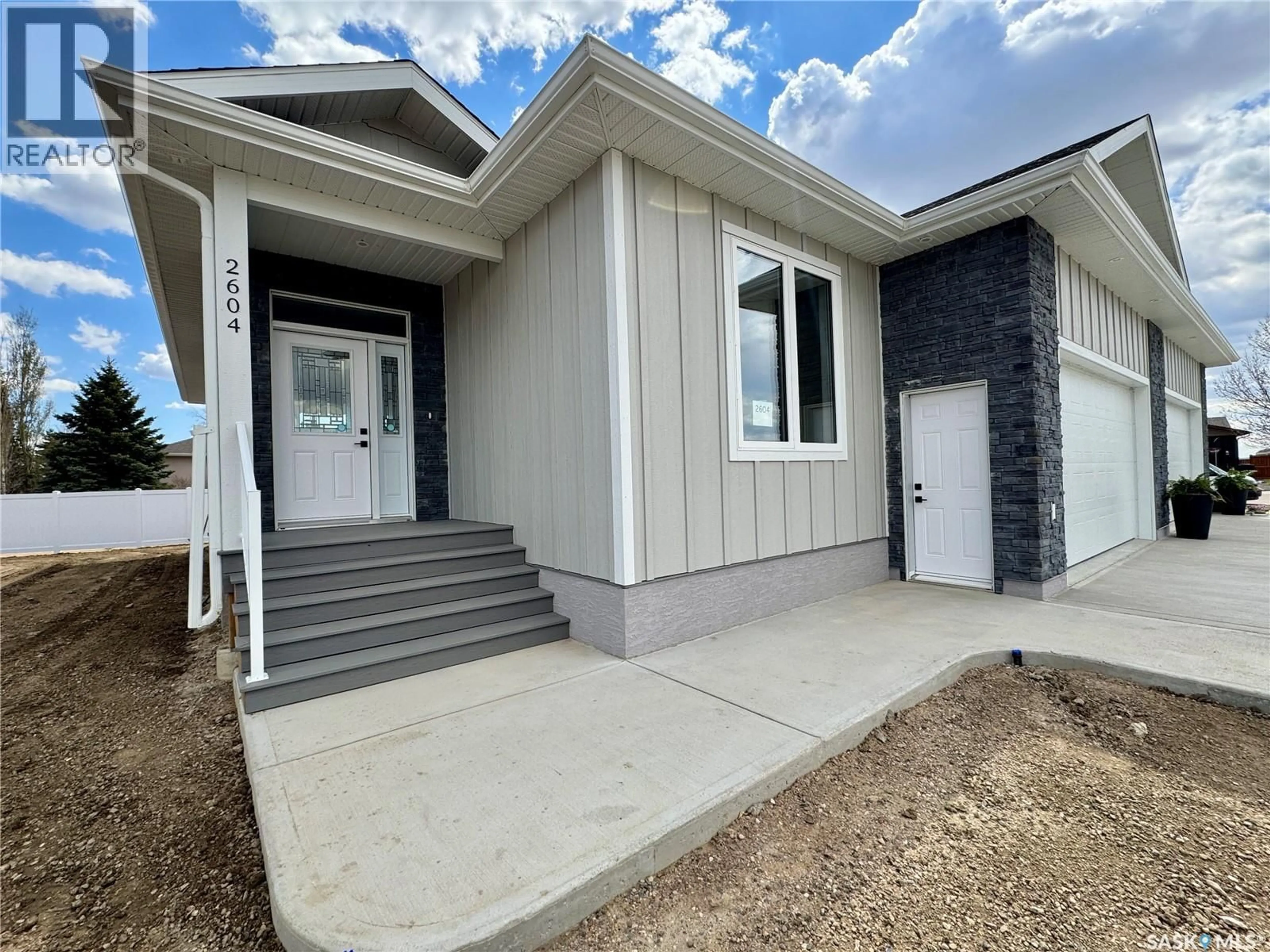 Home with vinyl exterior material, street for 2604 SANDPIPER ROAD, North Battleford Saskatchewan S9A3Z3