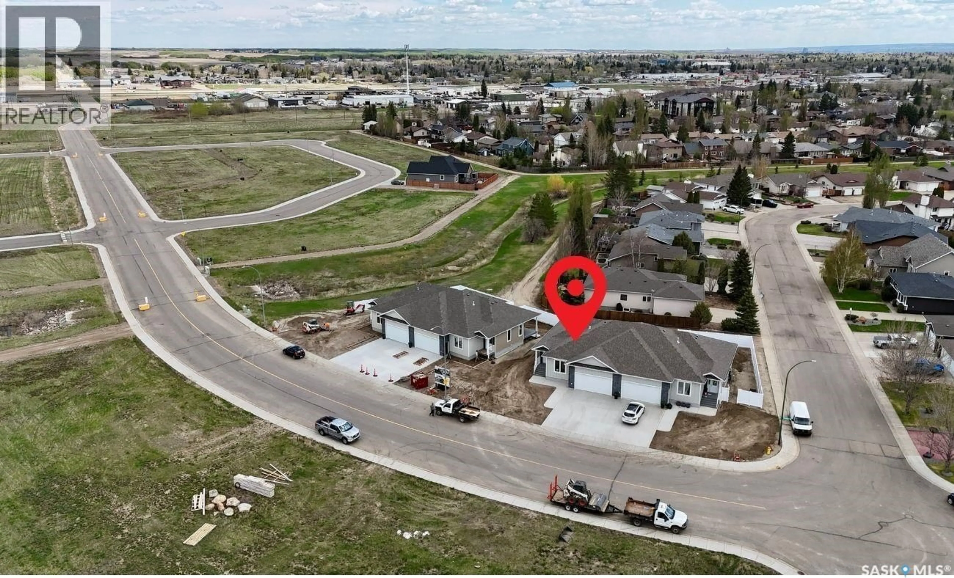 A pic from outside/outdoor area/front of a property/back of a property/a pic from drone, street for 2604 SANDPIPER ROAD, North Battleford Saskatchewan S9A3Z3