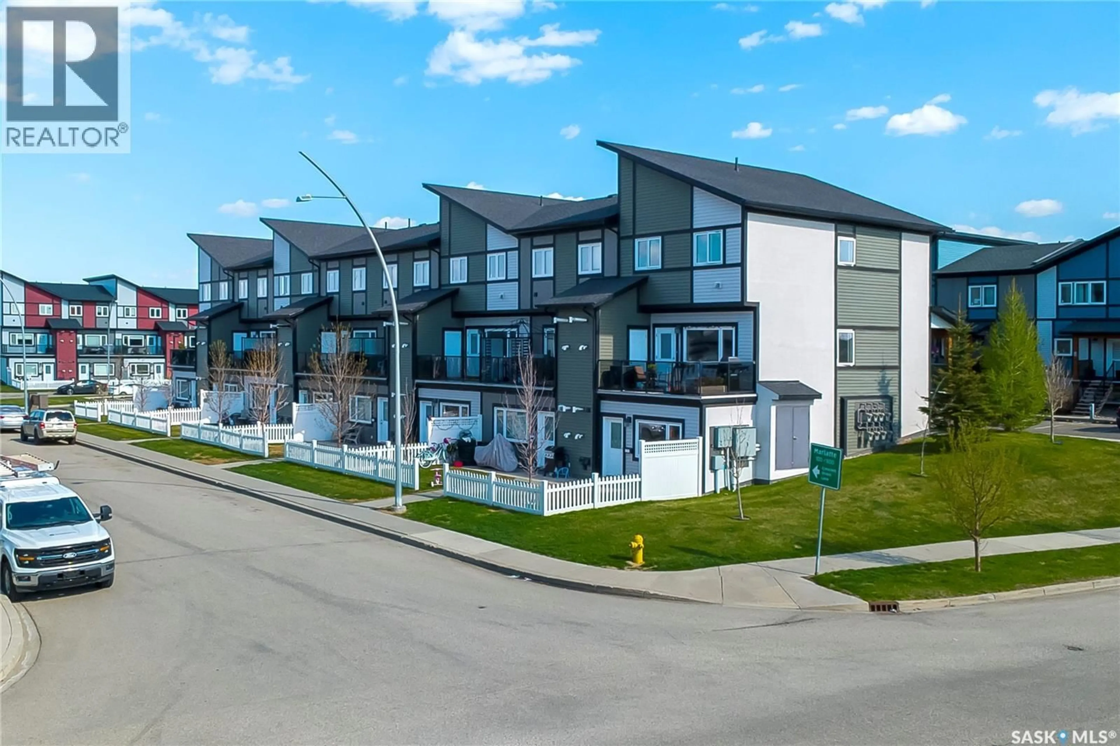 A pic from outside/outdoor area/front of a property/back of a property/a pic from drone, street for 130 - 1101 MARLATTE CRESCENT, Saskatoon Saskatchewan S7W0W1