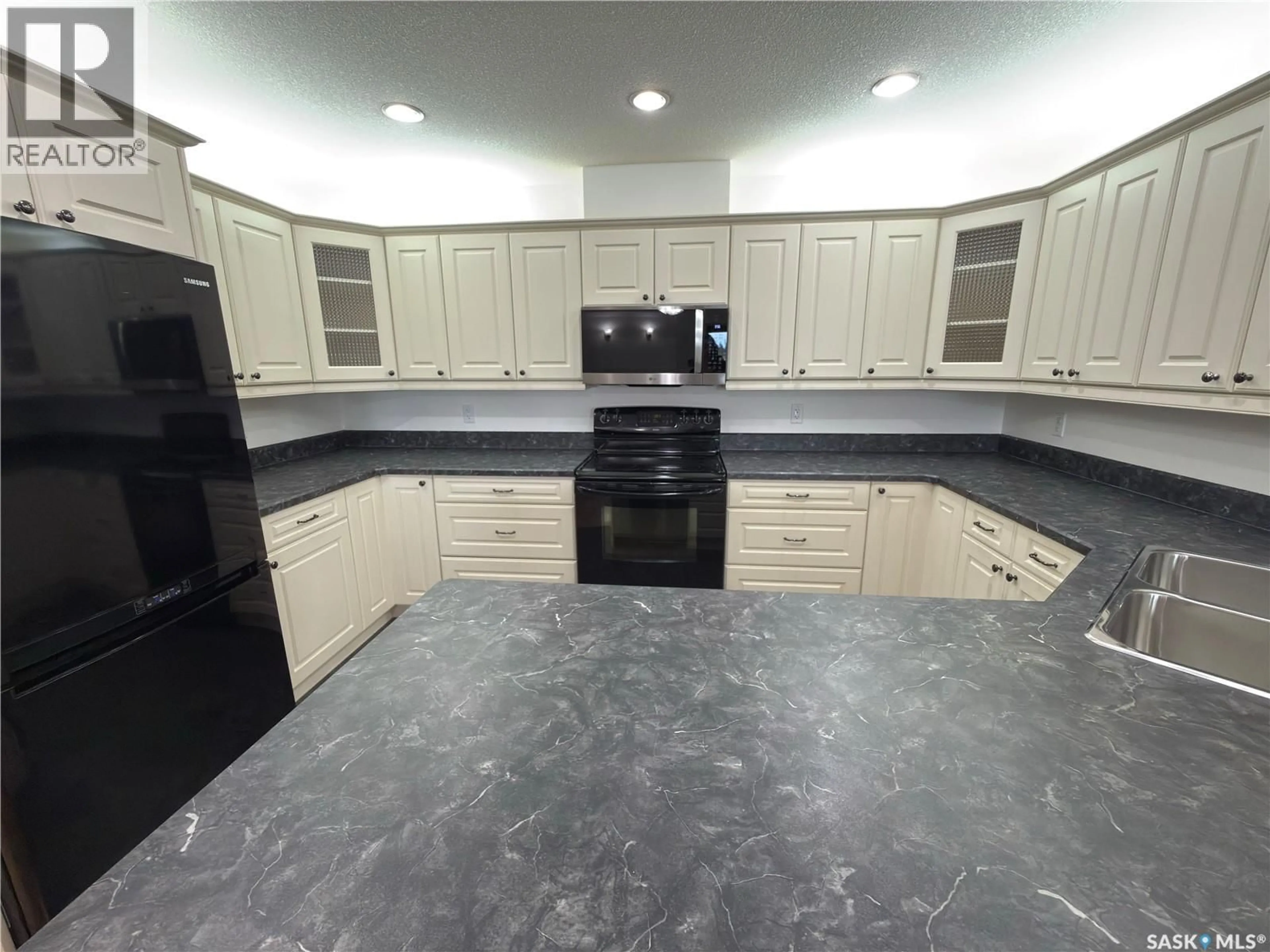Open concept kitchen, ceramic/tile floor for 404 395 RIVER STREET E, Prince Albert Saskatchewan S6V0A3