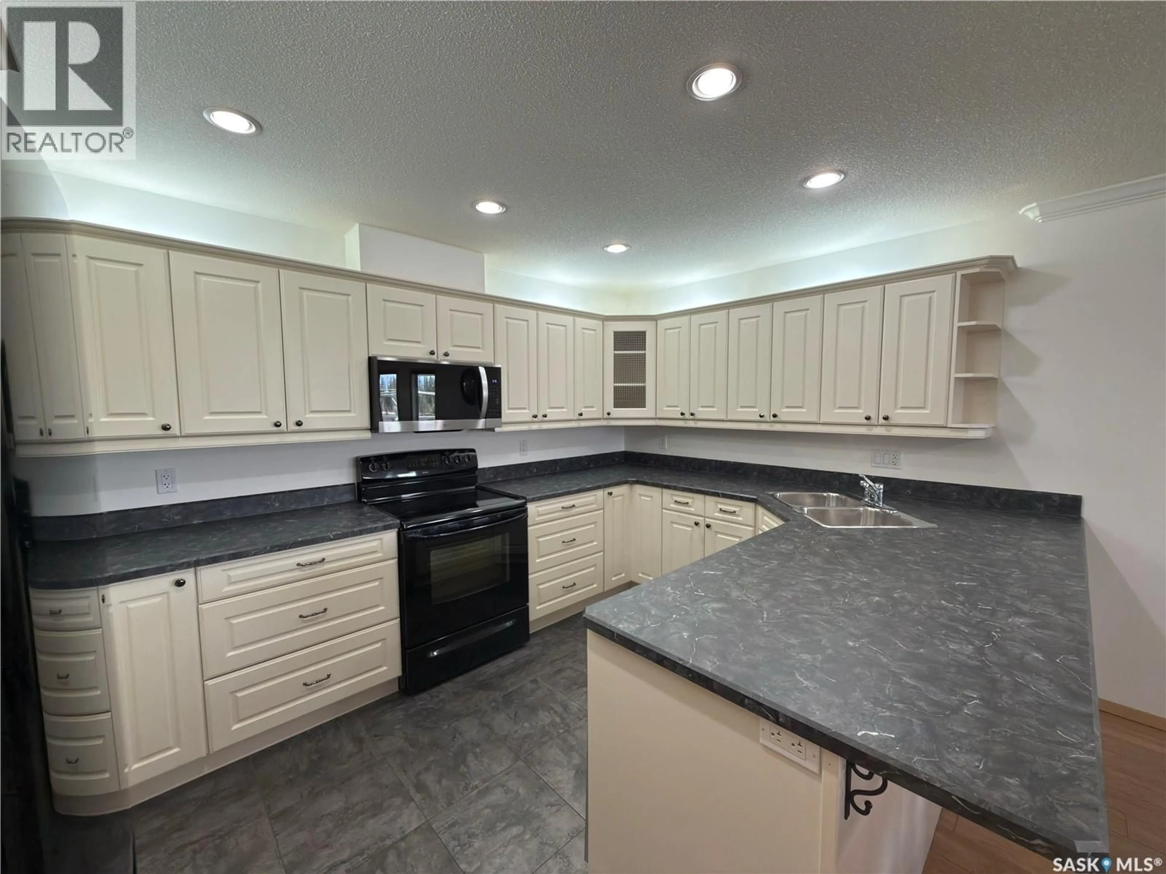 Open concept kitchen, ceramic/tile floor for 404 395 RIVER STREET E, Prince Albert Saskatchewan S6V0A3