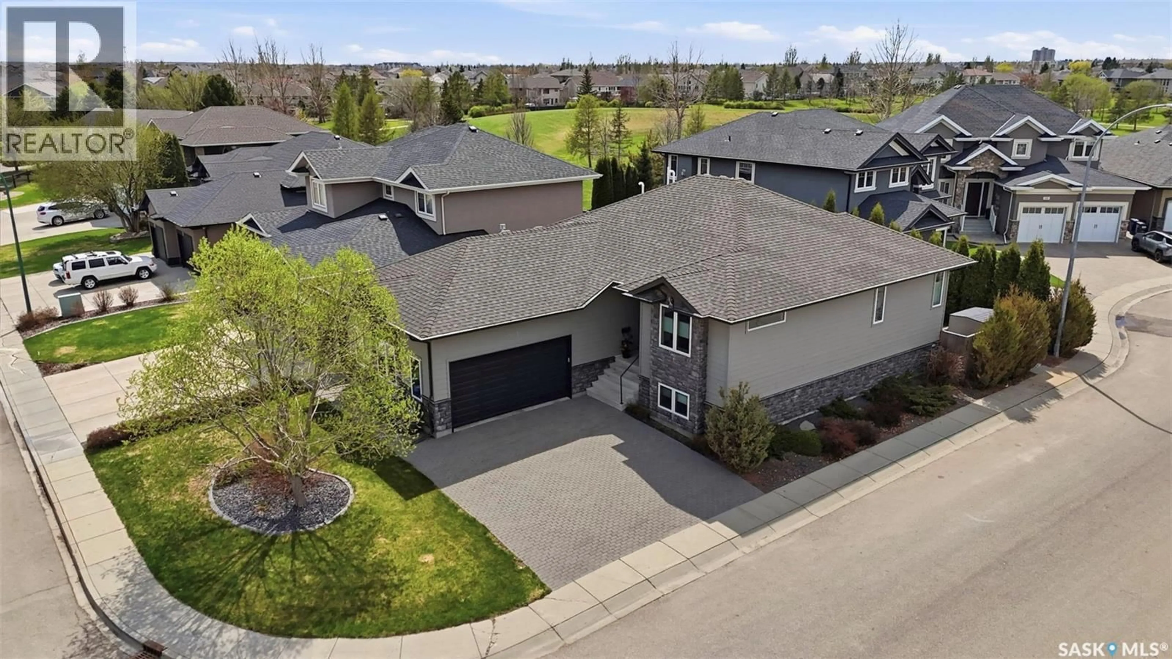 A pic from outside/outdoor area/front of a property/back of a property/a pic from drone, street for 303 BROOKMORE CRESCENT, Saskatoon Saskatchewan S7V0B1