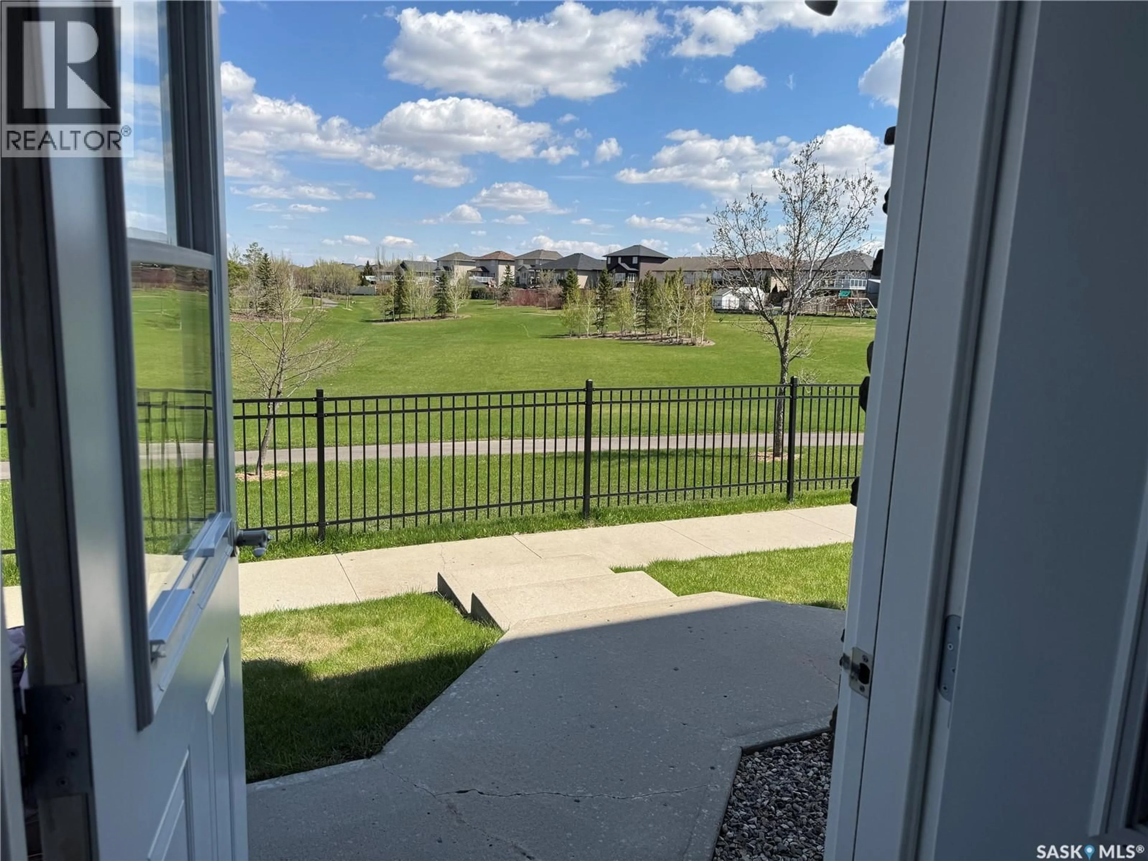 A pic from outside/outdoor area/front of a property/back of a property/a pic from drone, water/lake/river/ocean view for 409 - 1022 HAMPTON CIRCLE, Saskatoon Saskatchewan S7R0K3