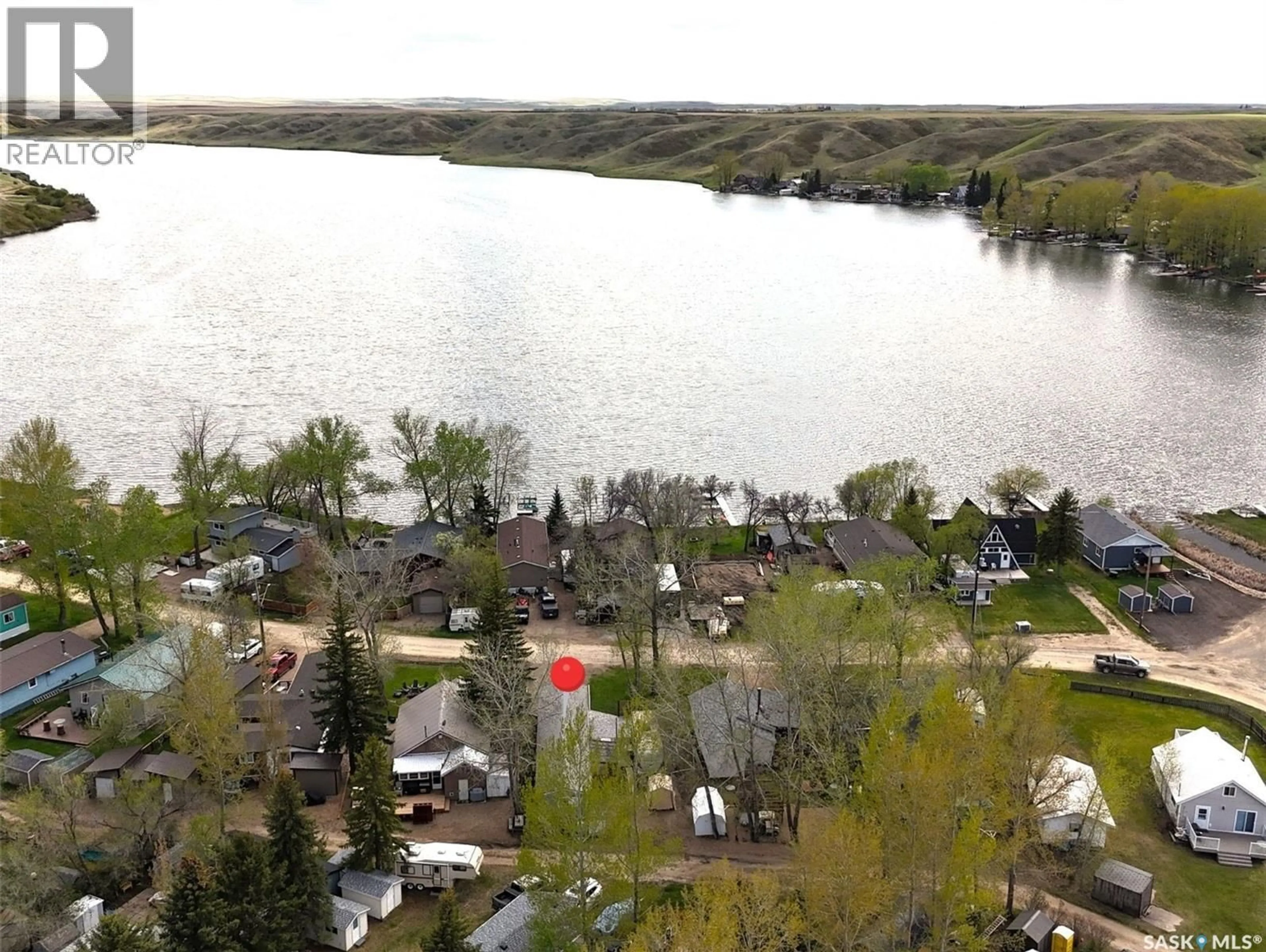 A pic from outside/outdoor area/front of a property/back of a property/a pic from drone, water/lake/river/ocean view for 205 ELIM DRIVE, Lac Pelletier Rm No. 107 Saskatchewan S0N2Y0