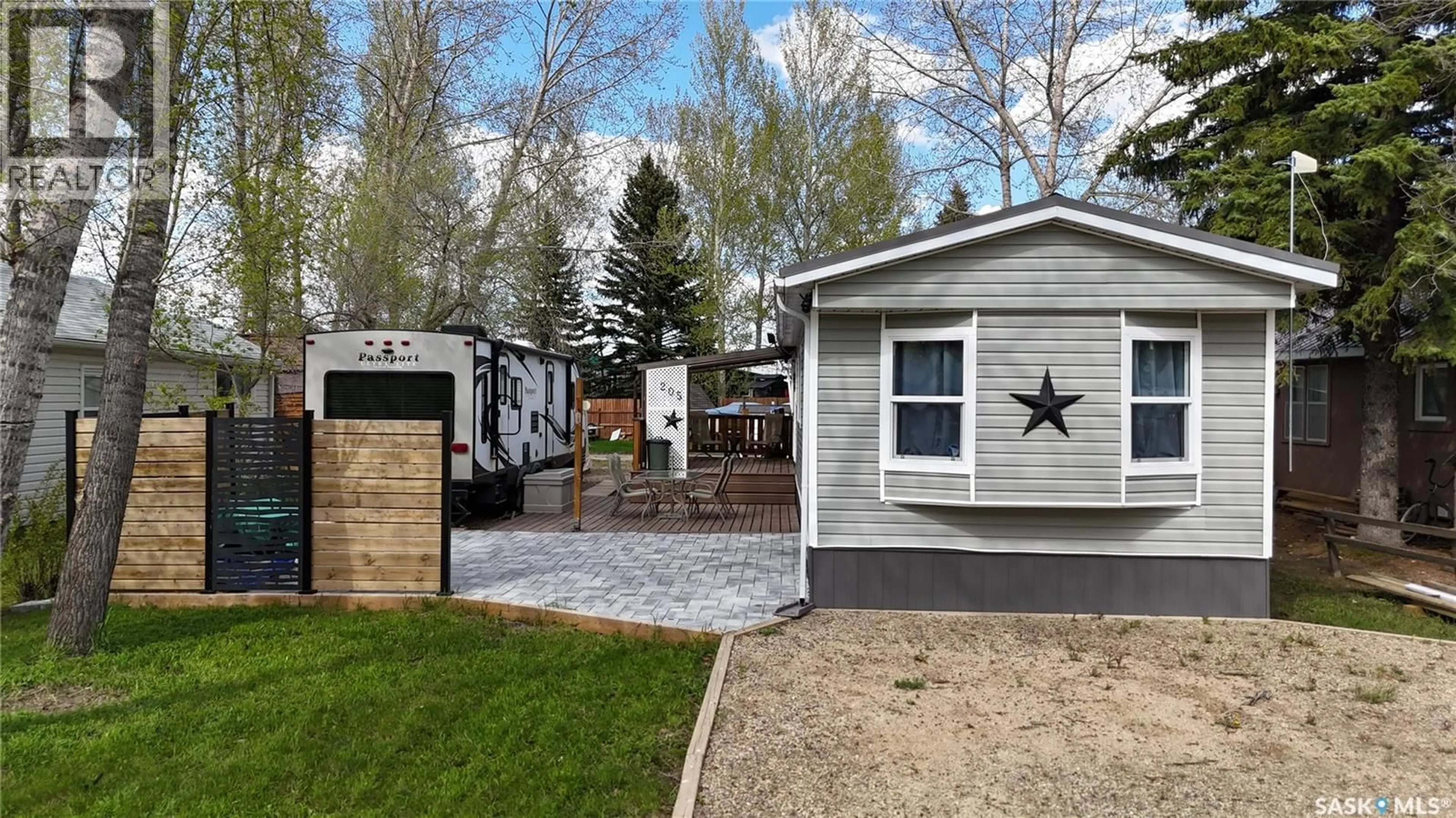 Home with vinyl exterior material, street for 205 ELIM DRIVE, Lac Pelletier Rm No. 107 Saskatchewan S0N2Y0