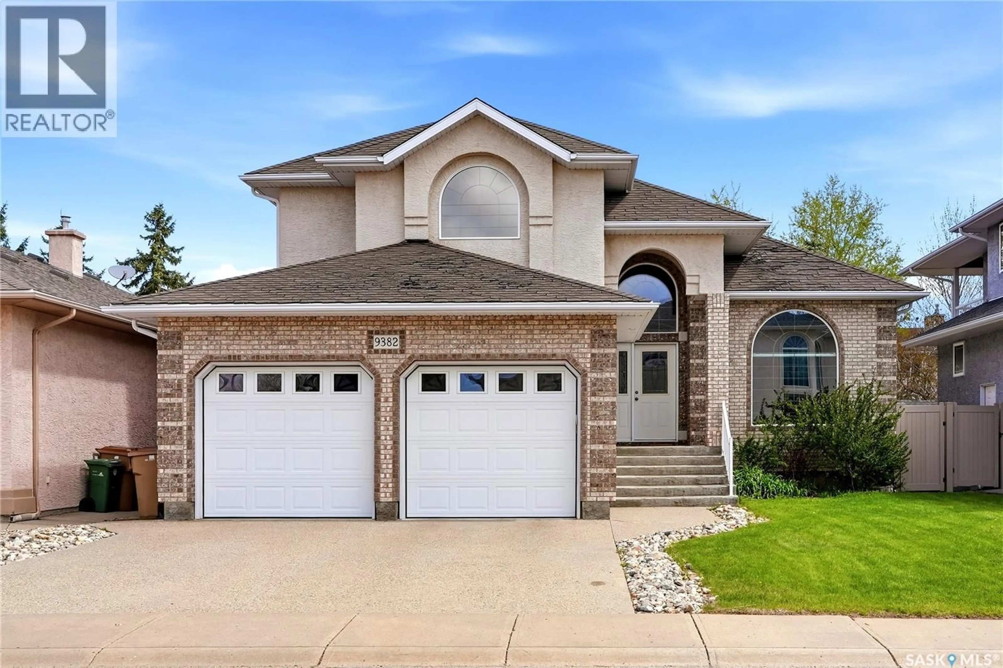 Home with brick exterior material, street for 9382 WASCANA MEWS, Regina Saskatchewan S4V2W4