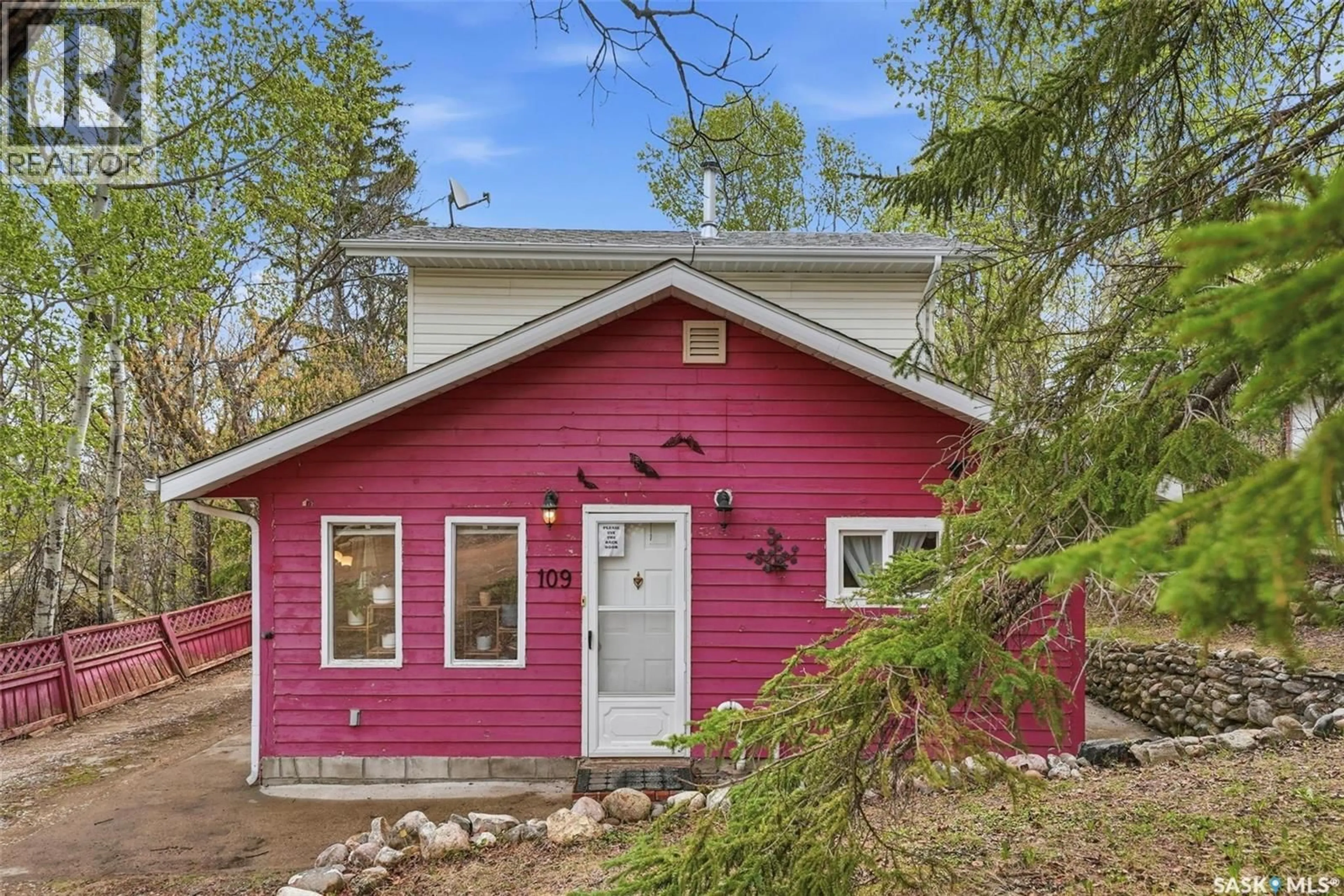 Home with vinyl exterior material, street for 107-109 SHAWONDASSE DRIVE, Manitou Beach Saskatchewan S0K4T1