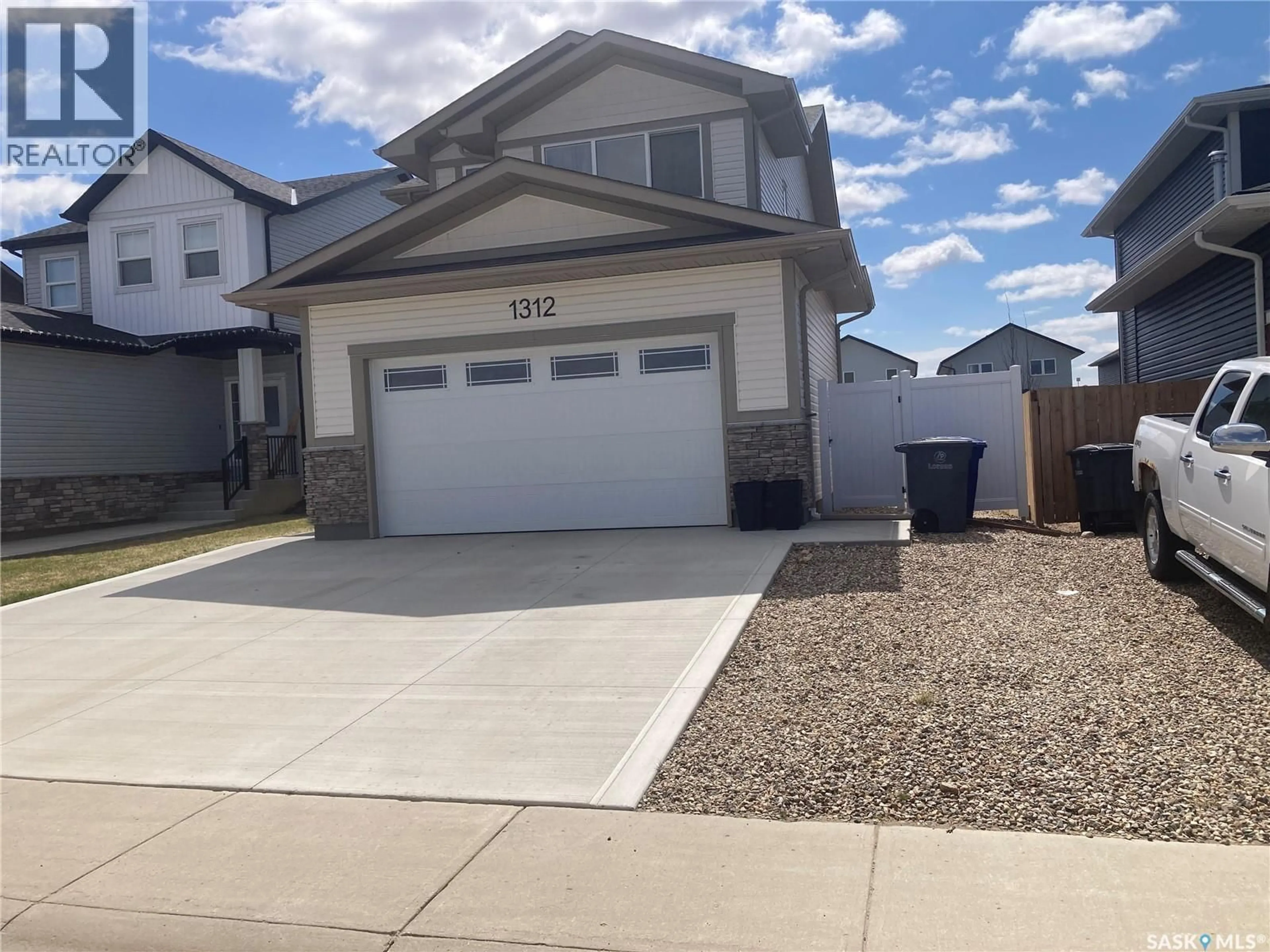 Home with vinyl exterior material, street for 1312 PARR HILL DRIVE, Martensville Saskatchewan S0K2T1