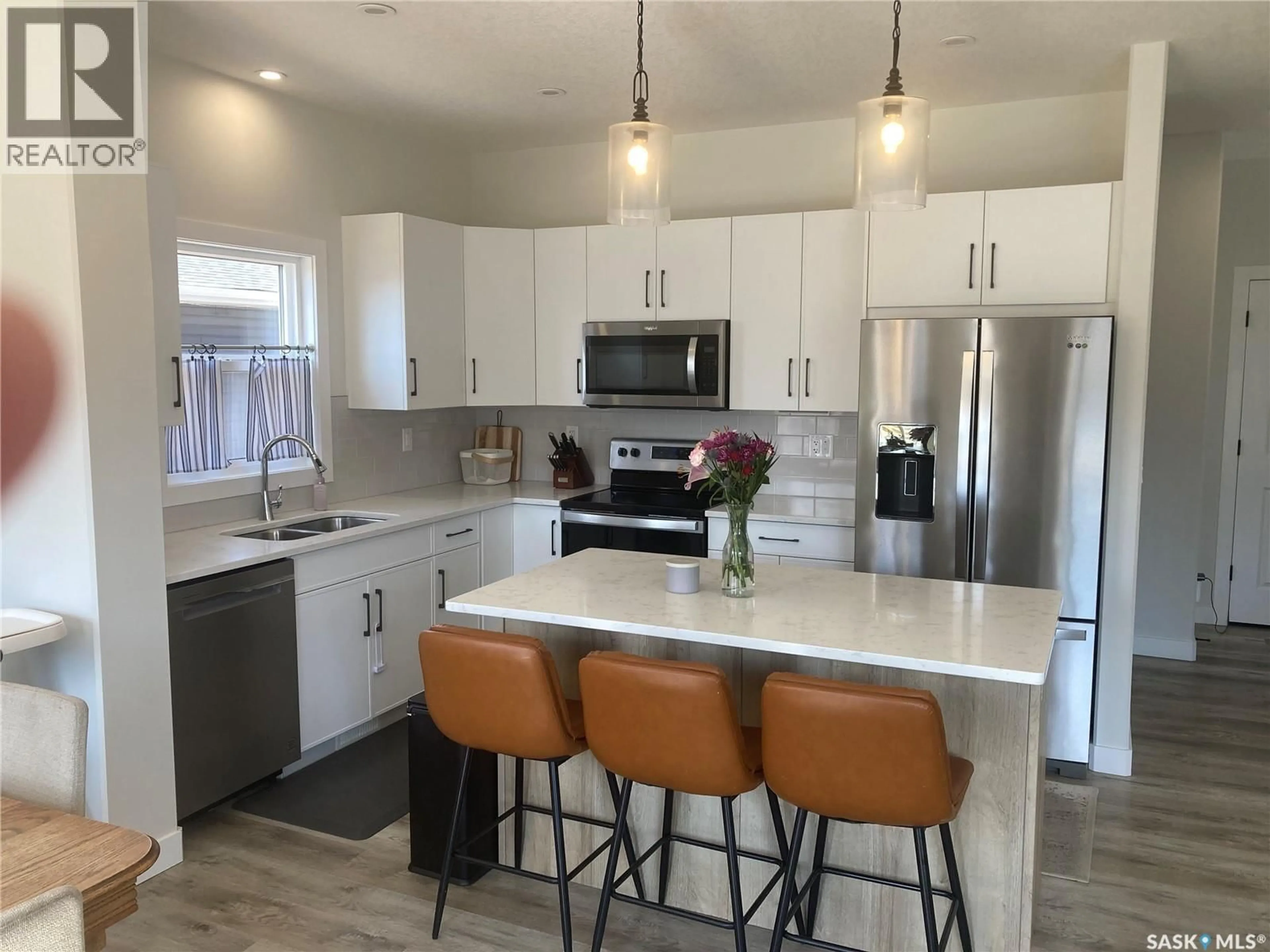 Open concept kitchen, ceramic/tile floor for 1312 PARR HILL DRIVE, Martensville Saskatchewan S0K2T1