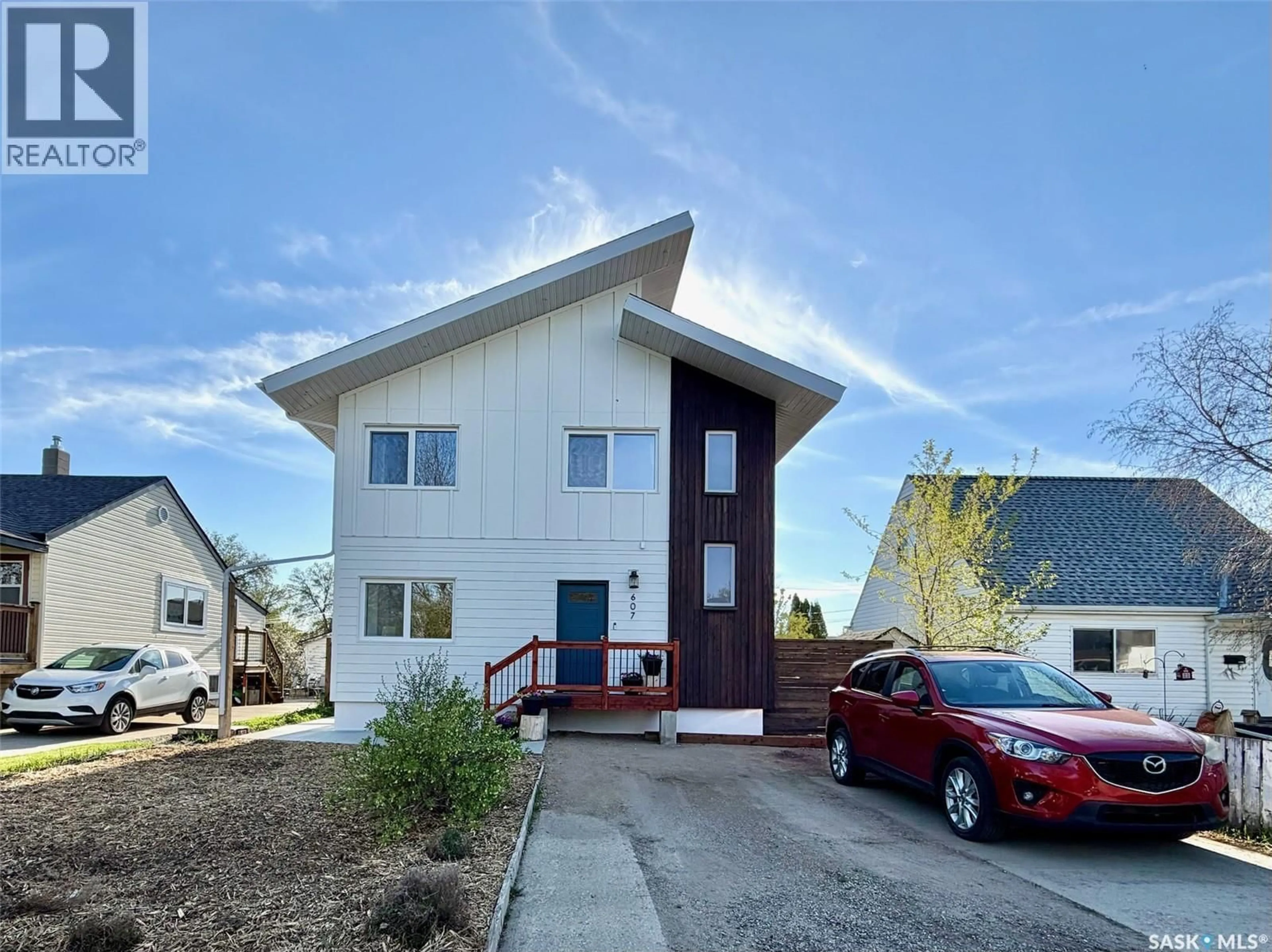 Home with vinyl exterior material, street for 607 K AVENUE, Saskatoon Saskatchewan S7M2E4