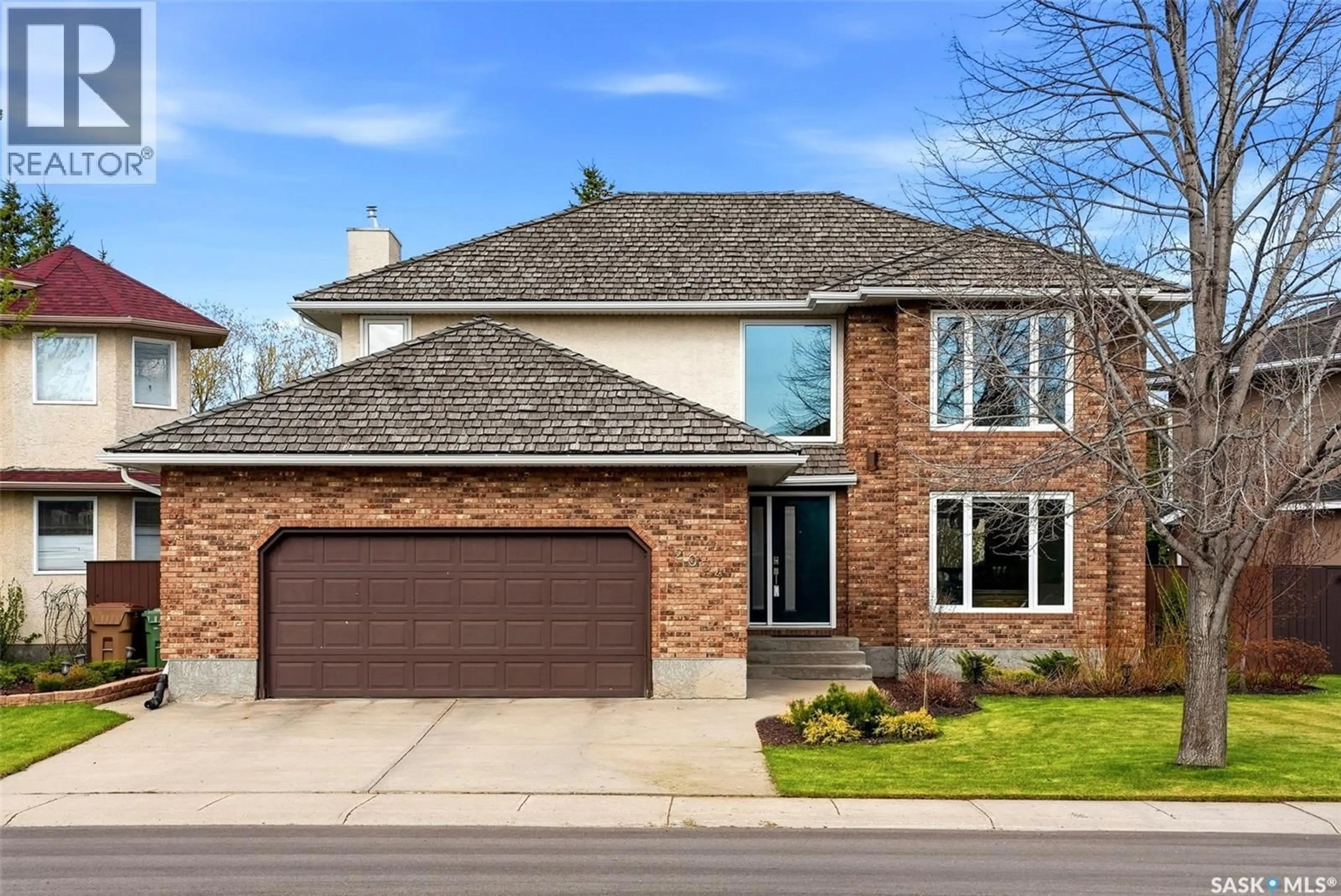 Home with brick exterior material, street for 2034 WASCANA GREENS, Regina Saskatchewan S4V2M1