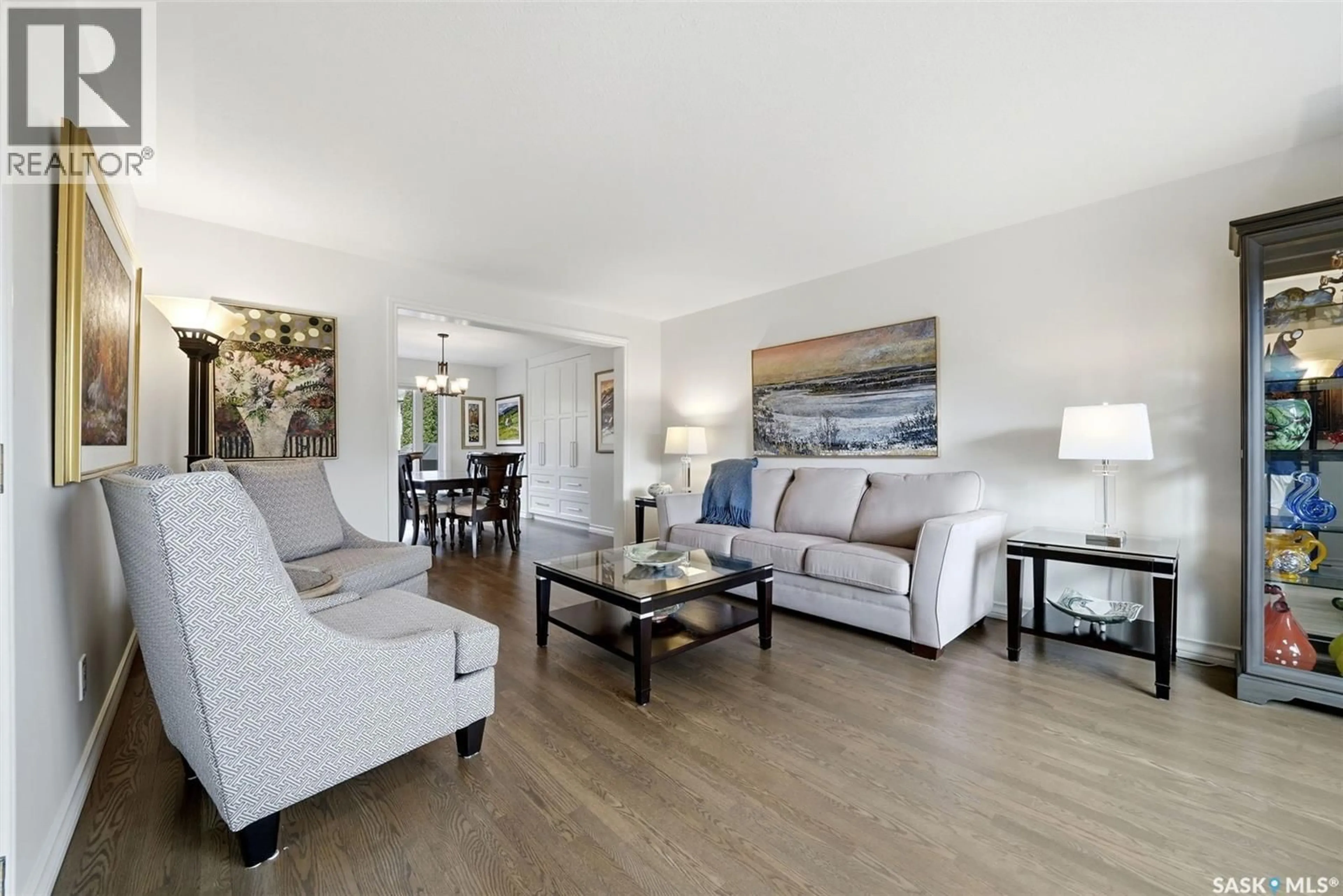 Living room with furniture, wood/laminate floor for 2034 WASCANA GREENS, Regina Saskatchewan S4V2M1