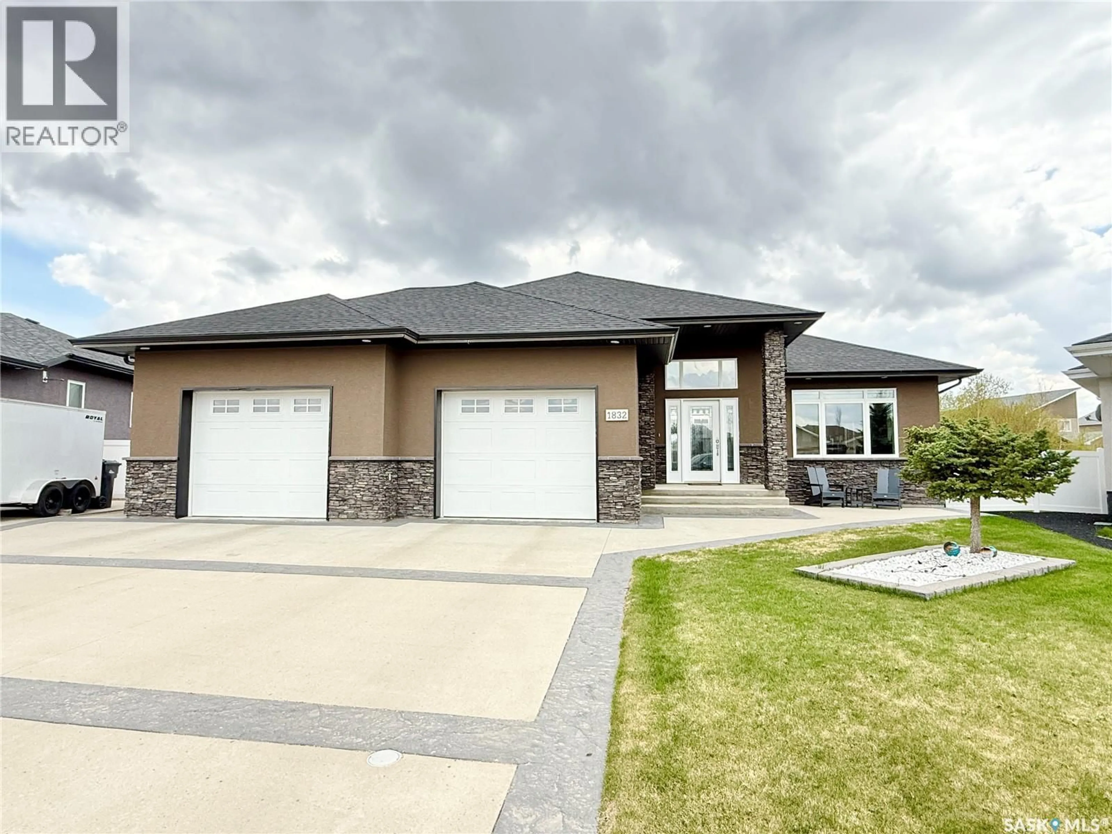 Home with vinyl exterior material, street for 1832 GORDON MILES PLACE, Weyburn Saskatchewan S4H0B9