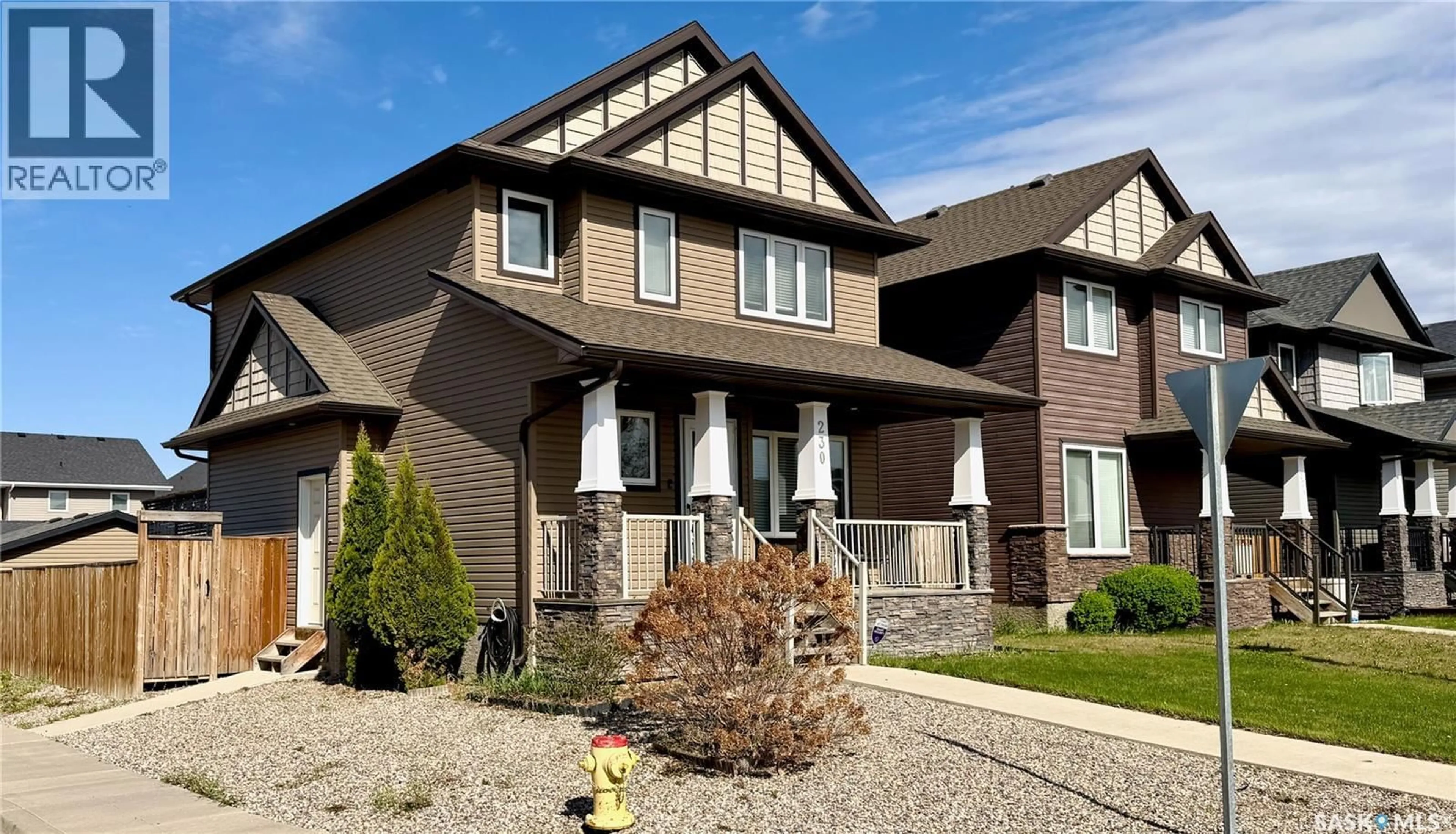 Home with brick exterior material, street for 230 VELTKAMP LANE, Saskatoon Saskatchewan S7T0S1