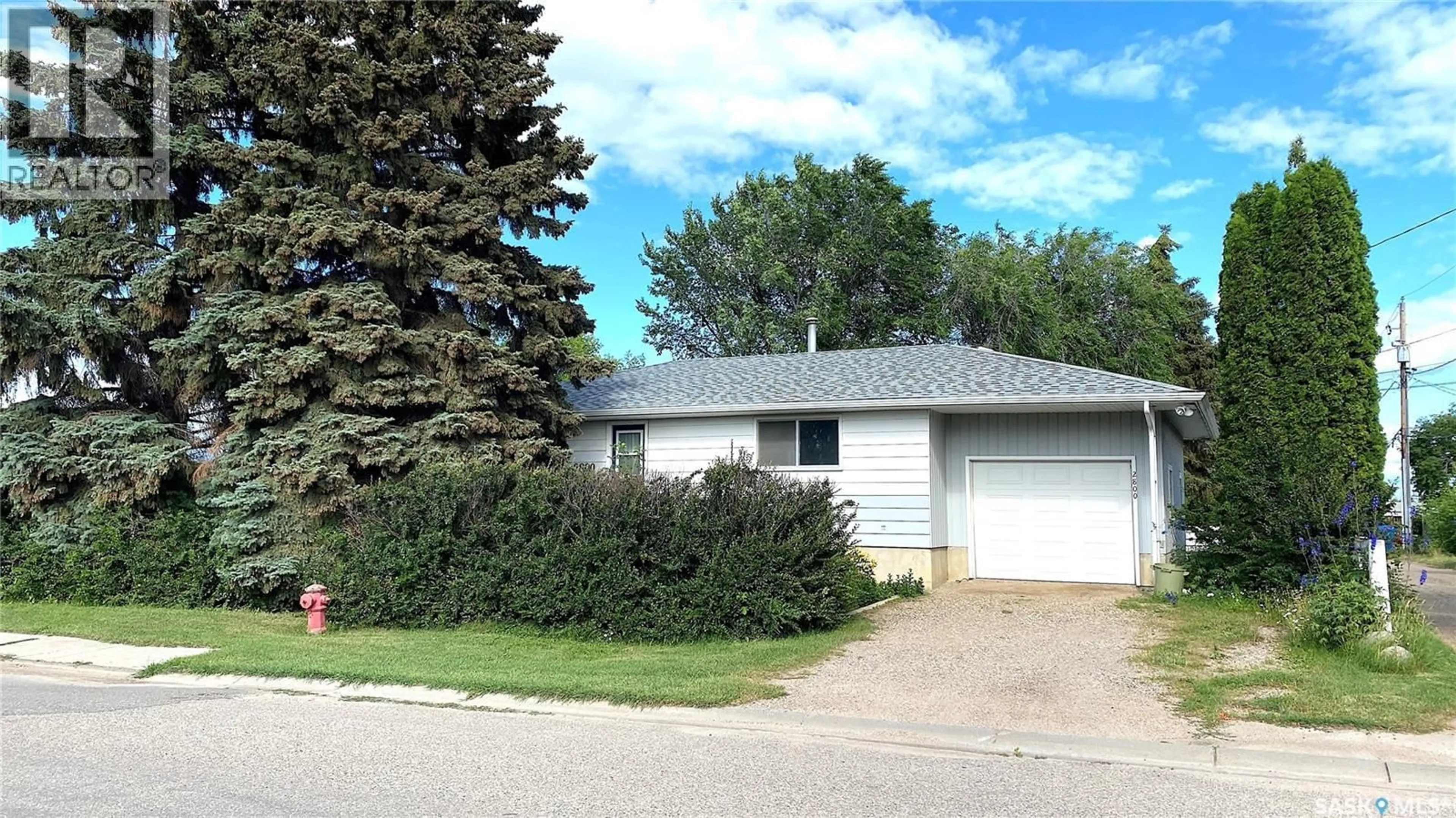 Home with vinyl exterior material, street for 2800 1ST AVENUE, Prince Albert Saskatchewan S6V2C8
