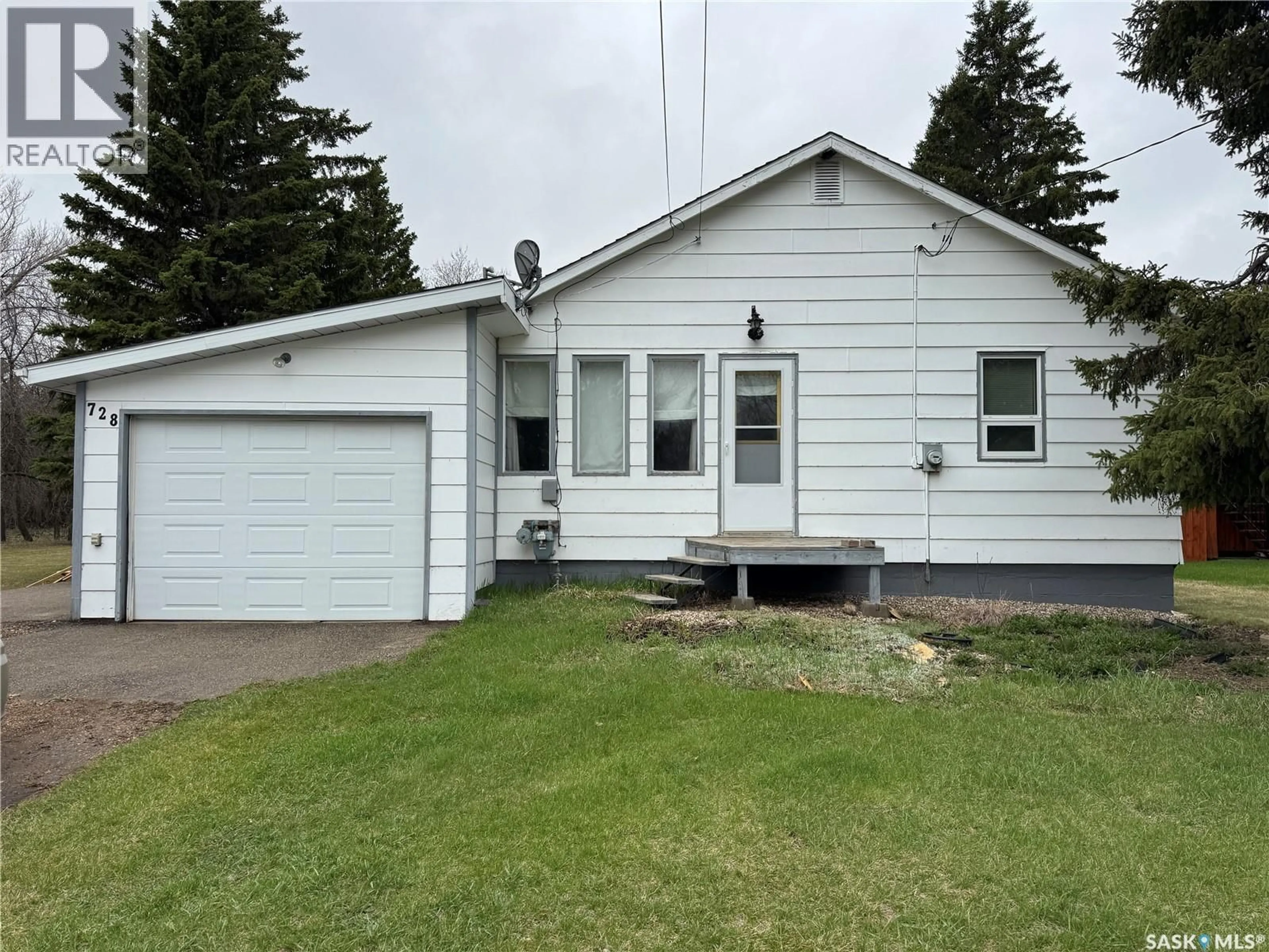 Home with vinyl exterior material, street for 728 MCINTOSH STREET, Foam Lake Saskatchewan S0A1A0