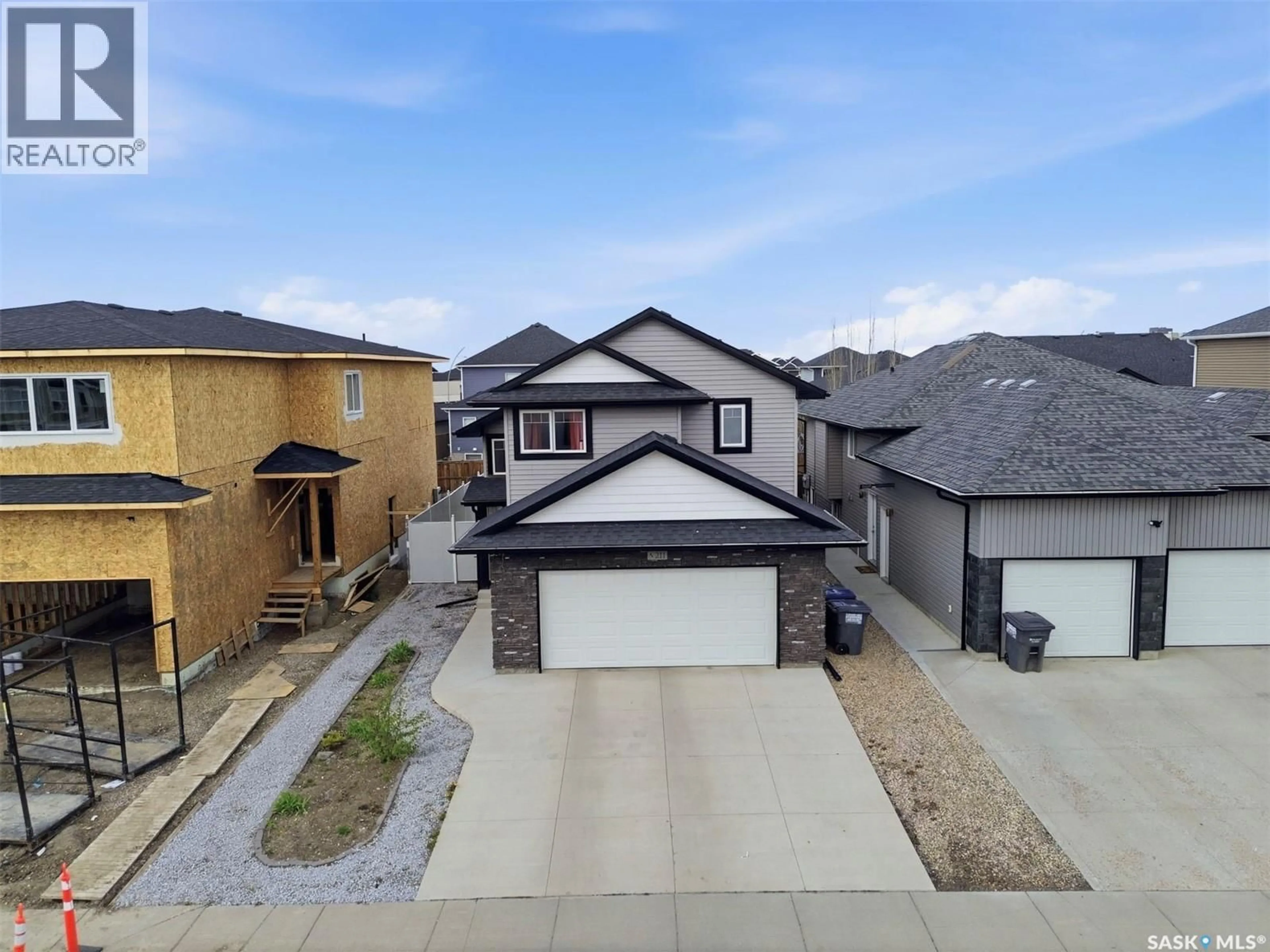 A pic from outside/outdoor area/front of a property/back of a property/a pic from drone, street for 211 BALTZAN BOULEVARD, Saskatoon Saskatchewan S7W0S2