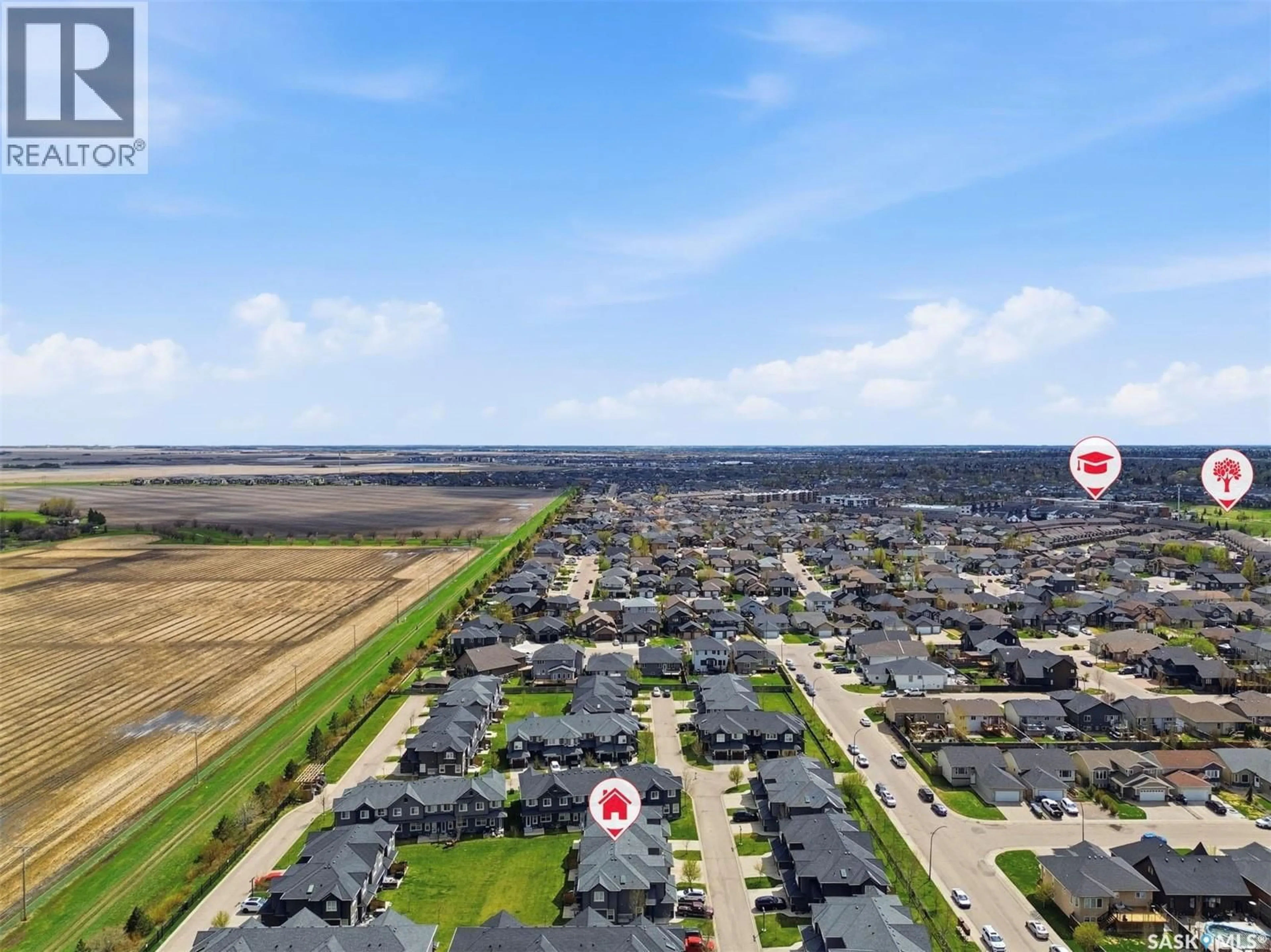 A pic from outside/outdoor area/front of a property/back of a property/a pic from drone, water/lake/river/ocean view for 427 1303 PATON CRESCENT, Saskatoon Saskatchewan S7V0P6