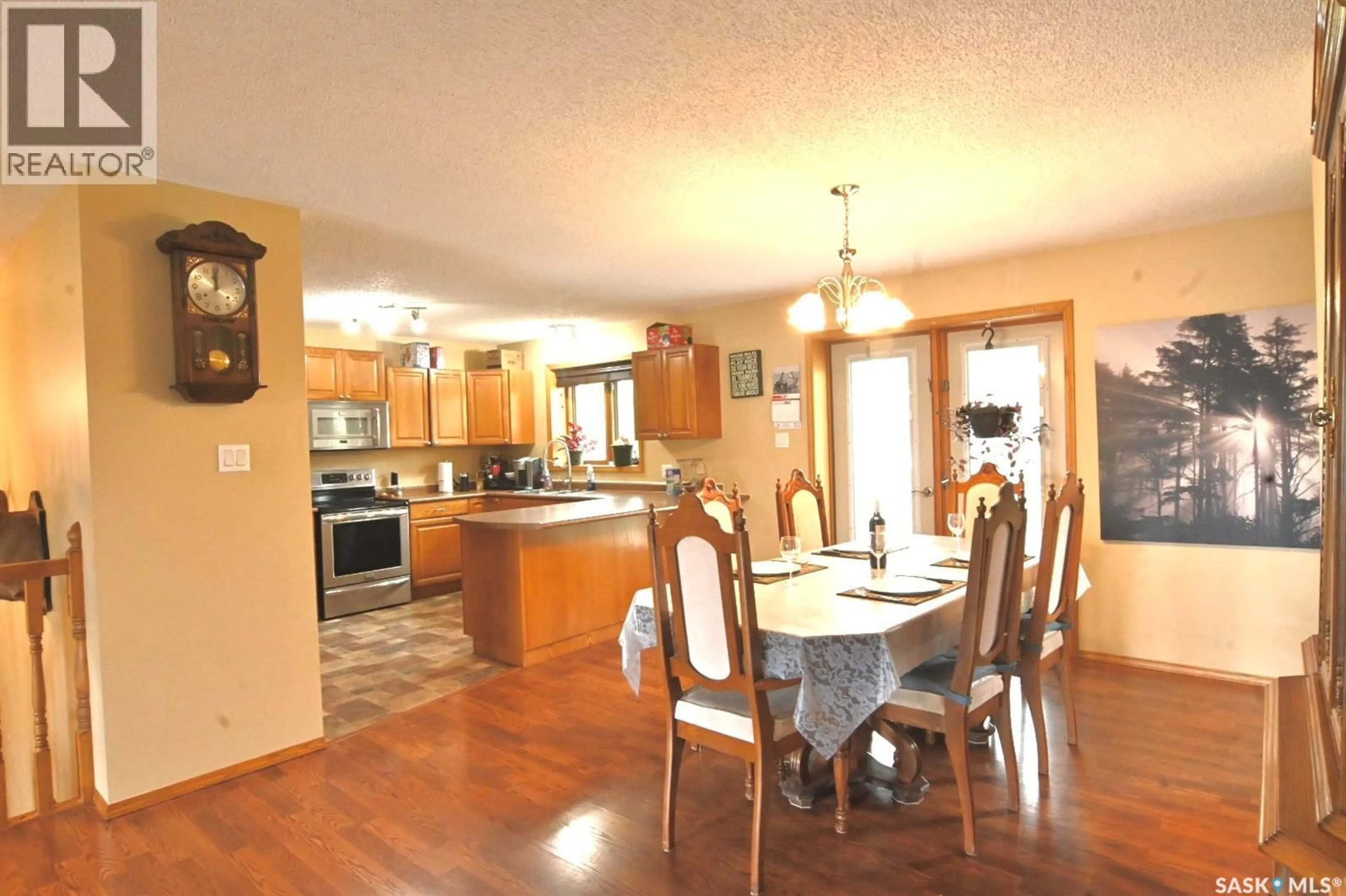 Dining room, wood/laminate floor for 311 WALTER SCOTT AVENUE, Hanley Saskatchewan S0G2E0