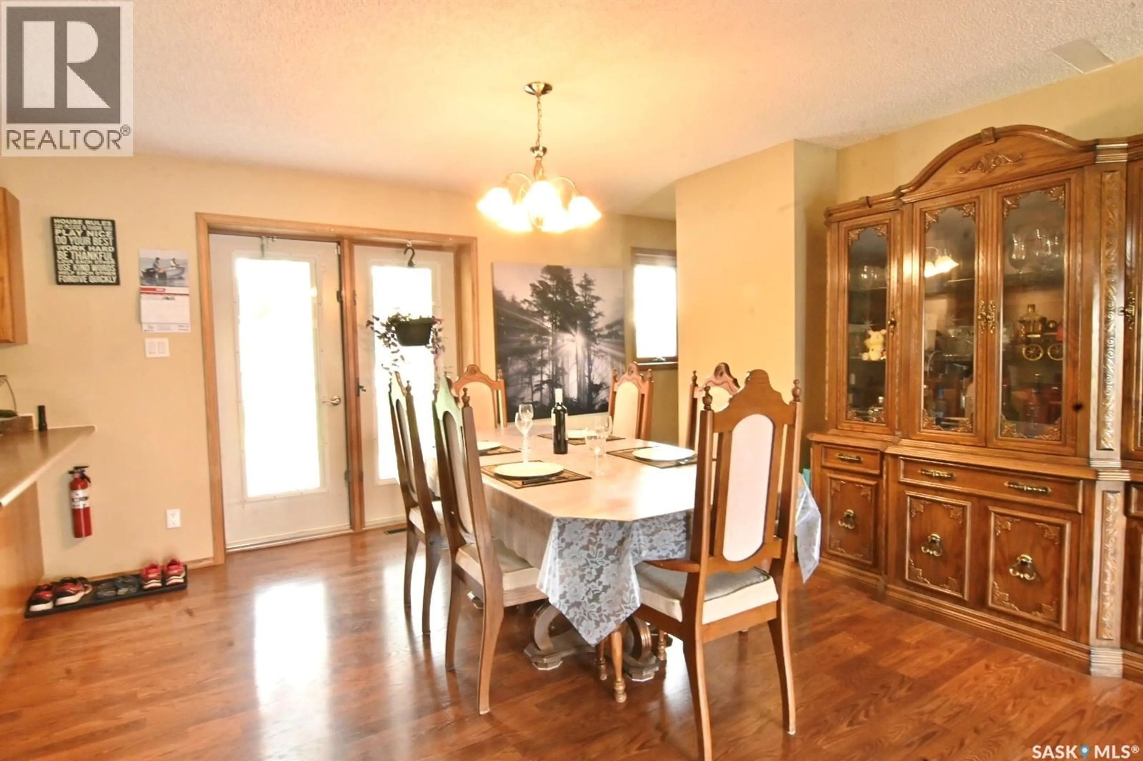 Dining room, wood/laminate floor for 311 WALTER SCOTT AVENUE, Hanley Saskatchewan S0G2E0