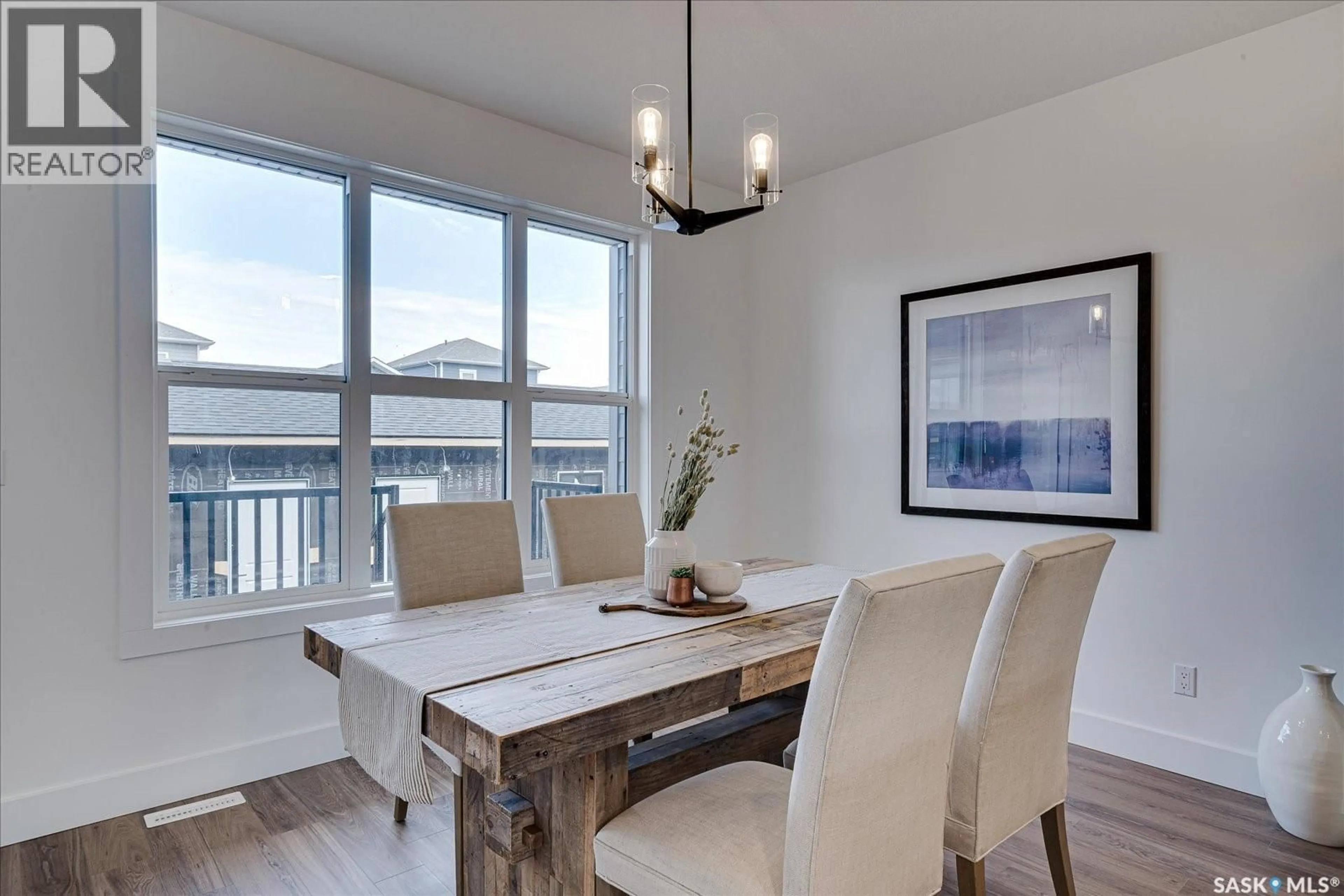 Dining room, wood/laminate floor for 145 ROSEWOOD BOULEVARD, Saskatoon Saskatchewan S7V0P4