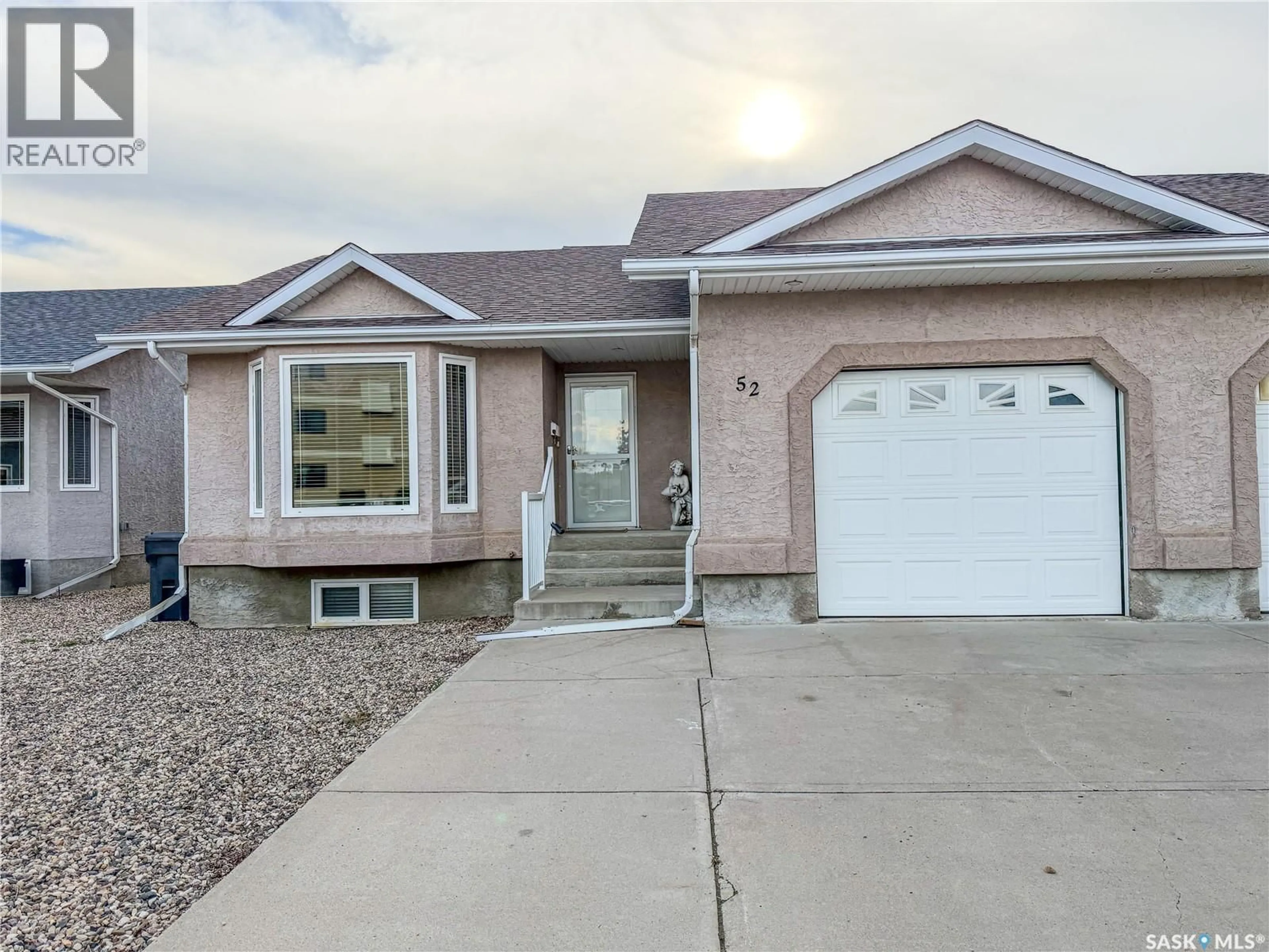 Home with vinyl exterior material, street for 52 RUSSELL DRIVE, Yorkton Saskatchewan S3N3W2