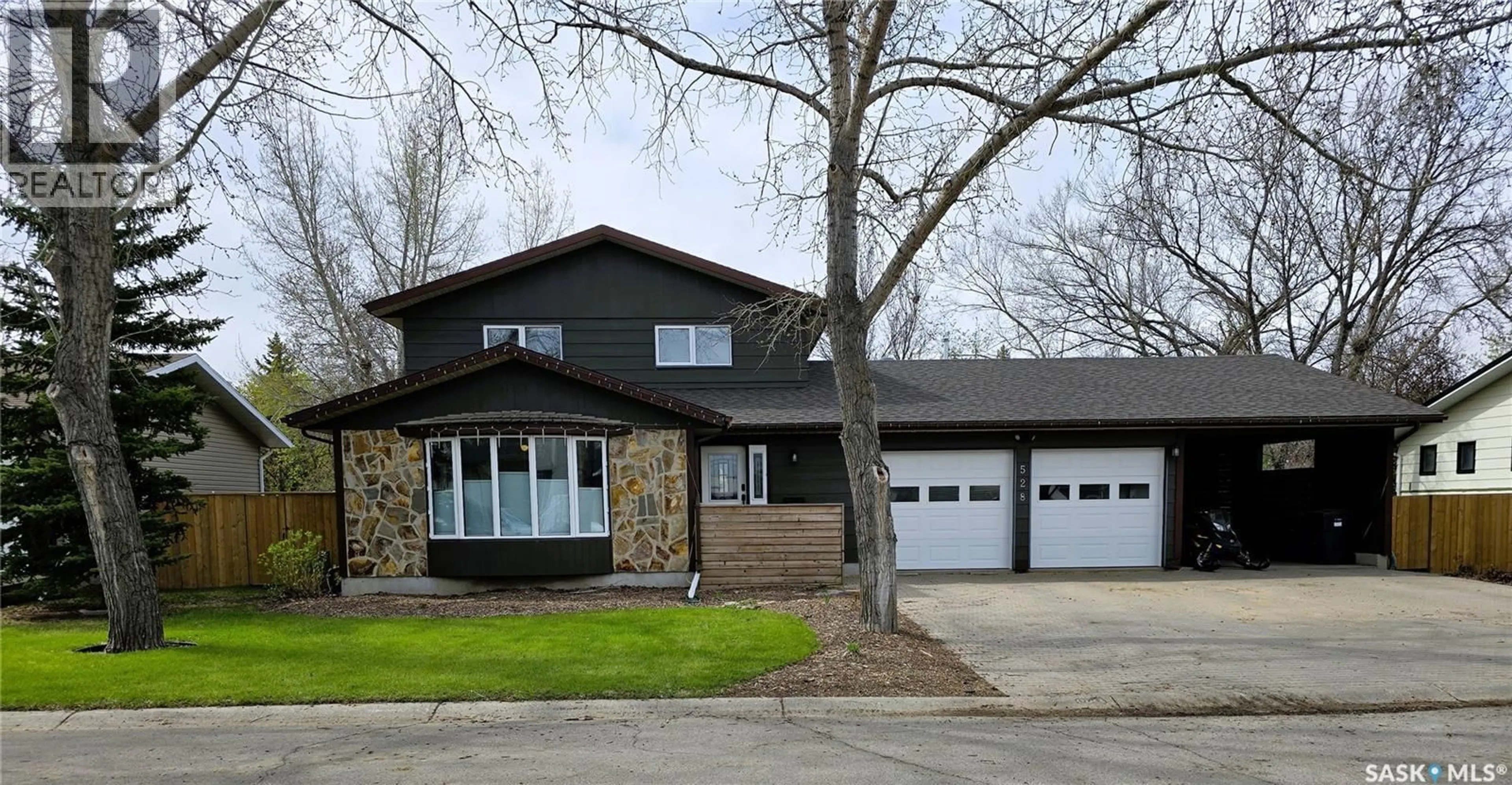 Home with vinyl exterior material, street for 528 DIEPPE DRIVE, Weyburn Saskatchewan S4H2Y2