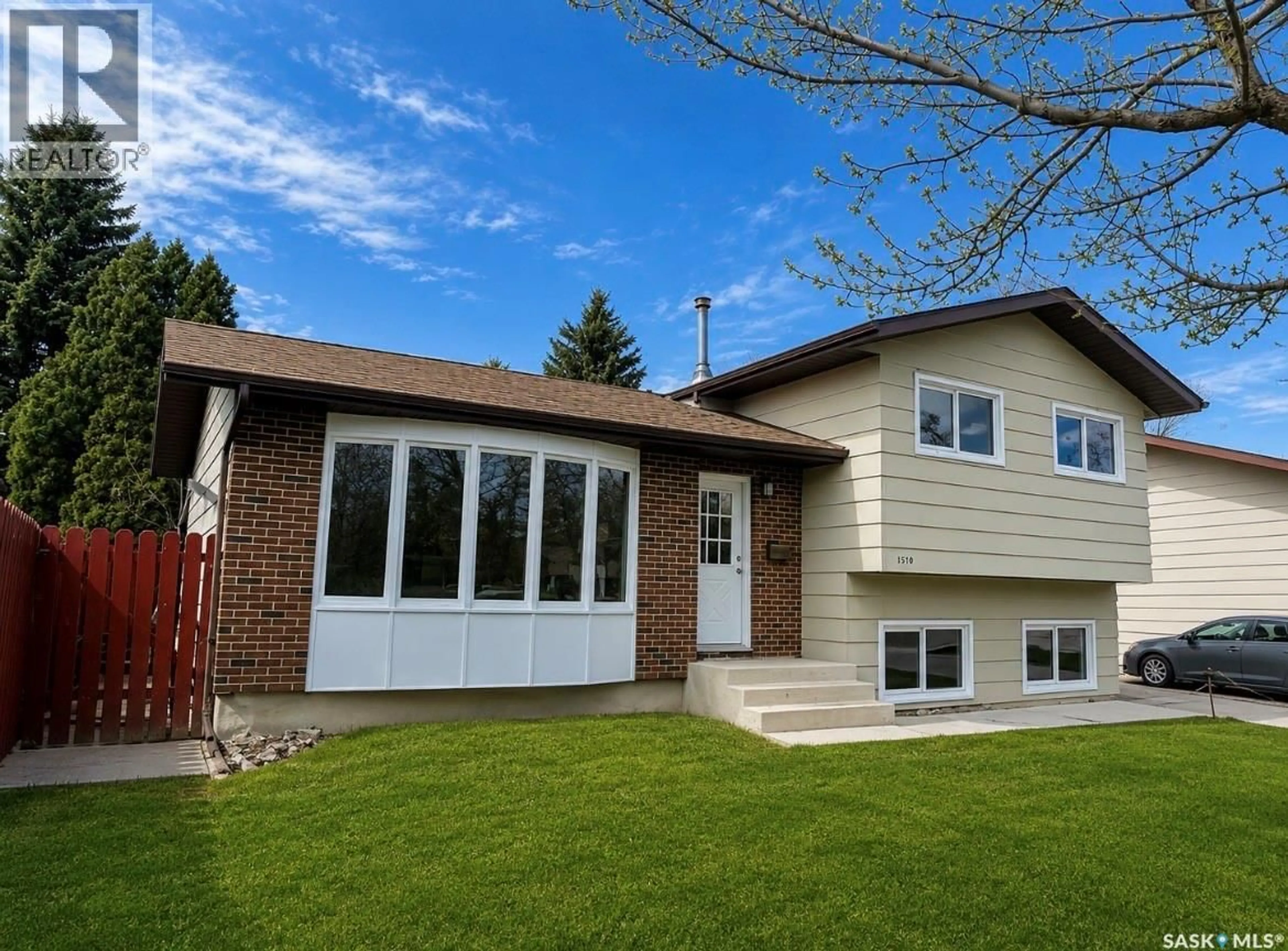 Home with vinyl exterior material, street for 1510 MCKERCHER DRIVE, Saskatoon Saskatchewan S7H5J9