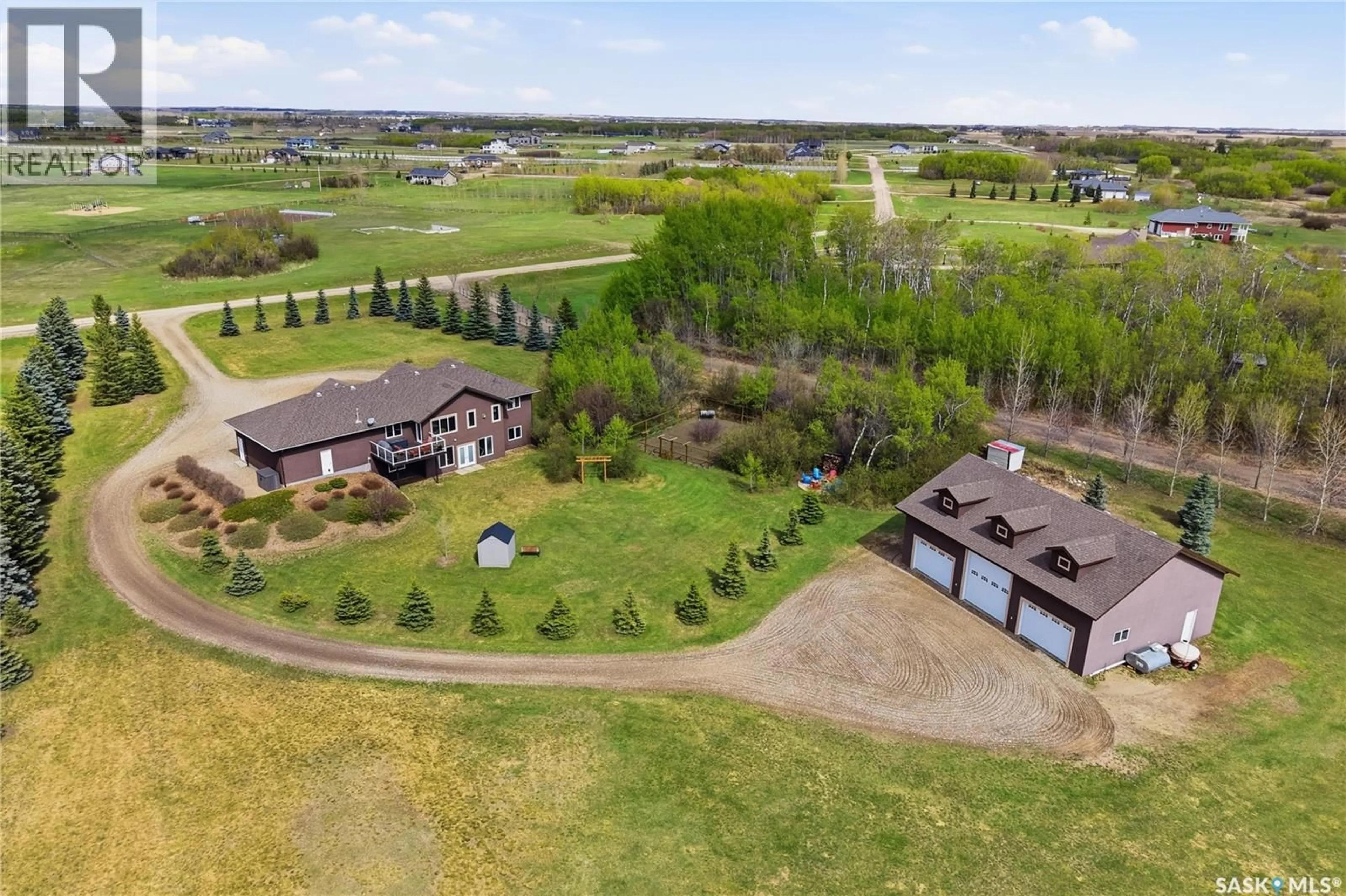 A pic from outside/outdoor area/front of a property/back of a property/a pic from drone, water/lake/river/ocean view for 11 COUNTRY ROAD, Dundurn Rm No. 314 Saskatchewan S7C0A7