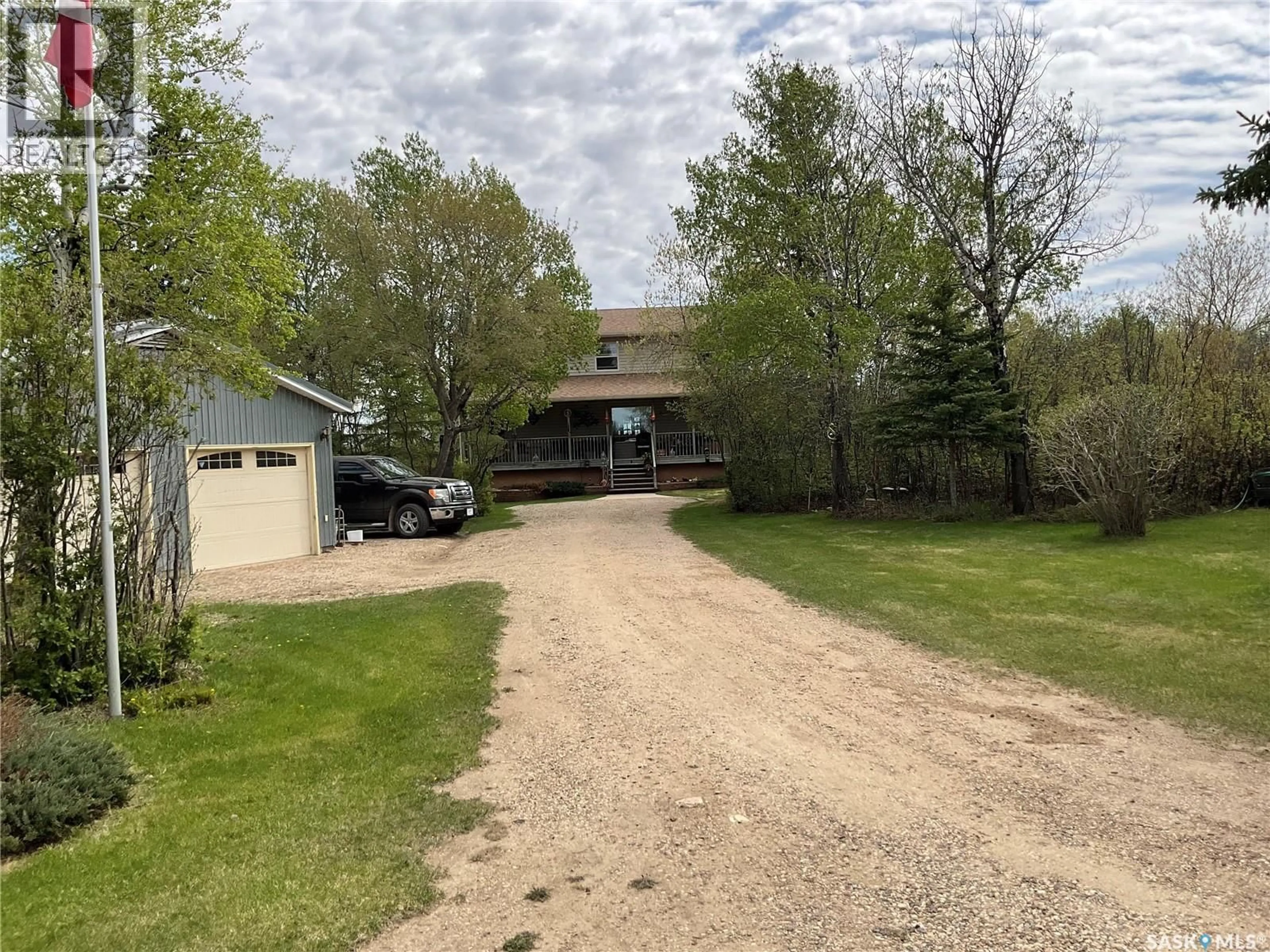 A pic from outside/outdoor area/front of a property/back of a property/a pic from drone, street for 5609 SCOTT'S POINT ROAD, Wakaw Saskatchewan S0K4P0
