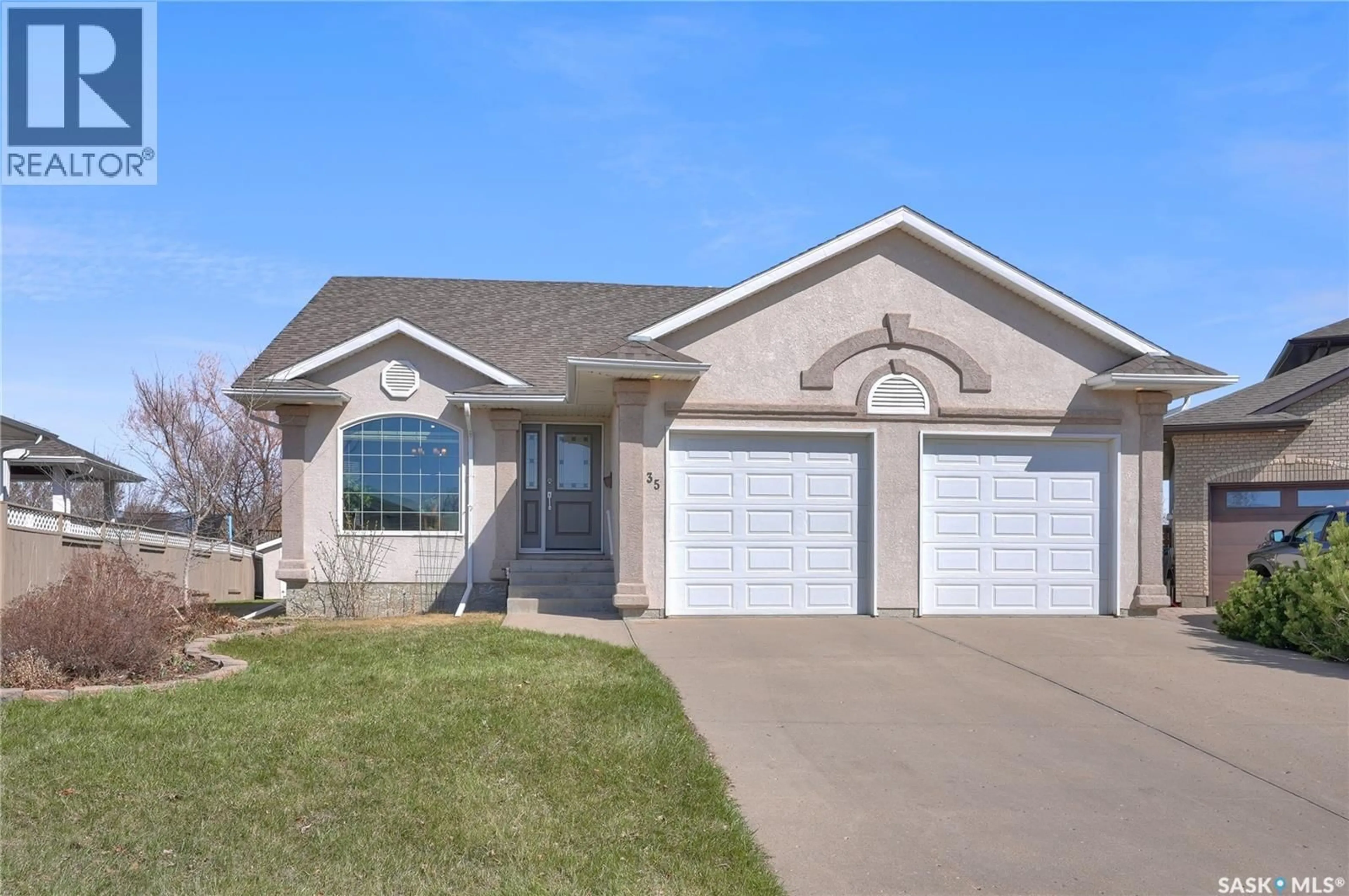 Home with vinyl exterior material, street for 35 MARIGOLD CRESCENT, Moose Jaw Saskatchewan S6J1L2