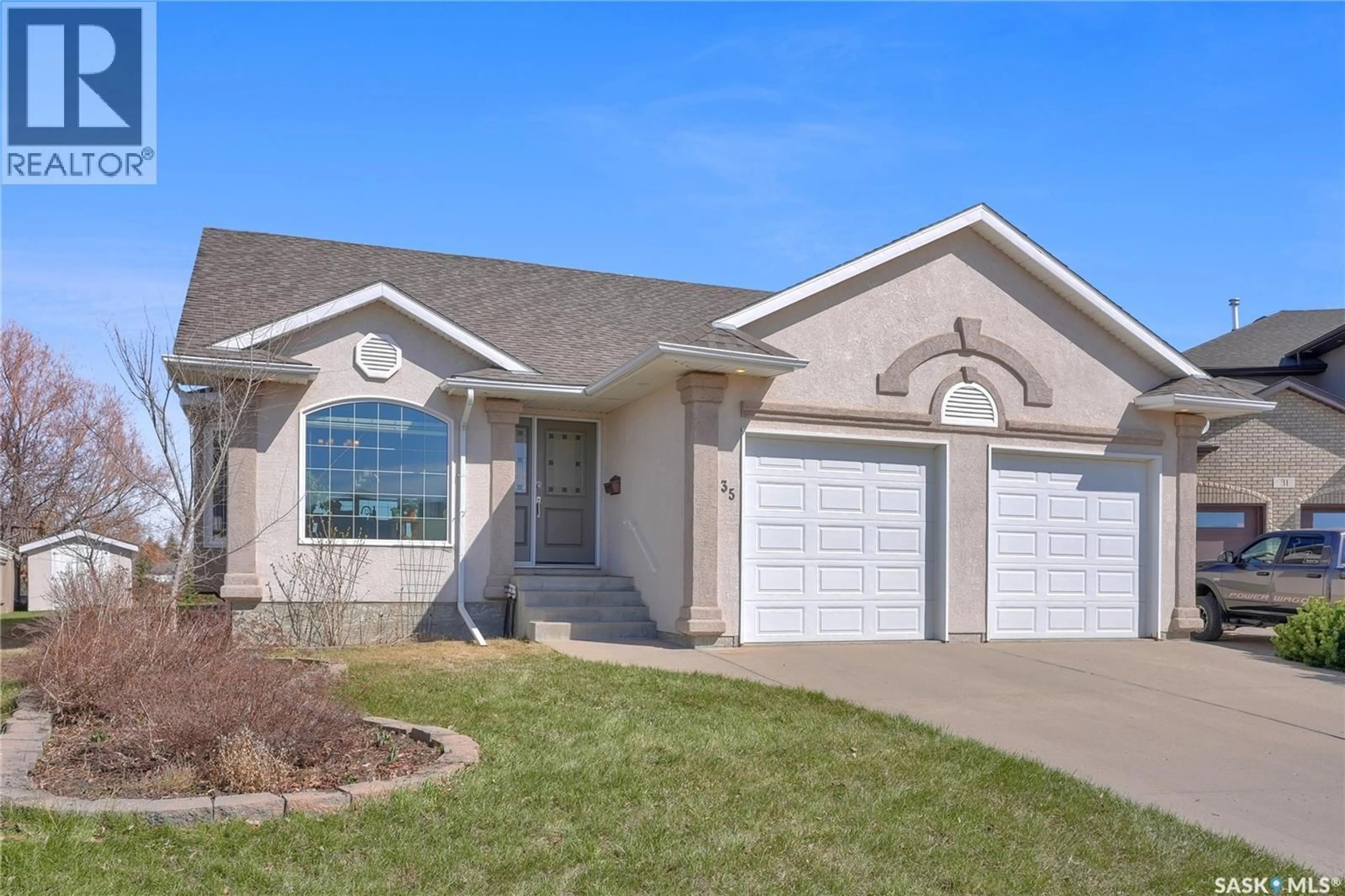 Home with vinyl exterior material, street for 35 MARIGOLD CRESCENT, Moose Jaw Saskatchewan S6J1L2
