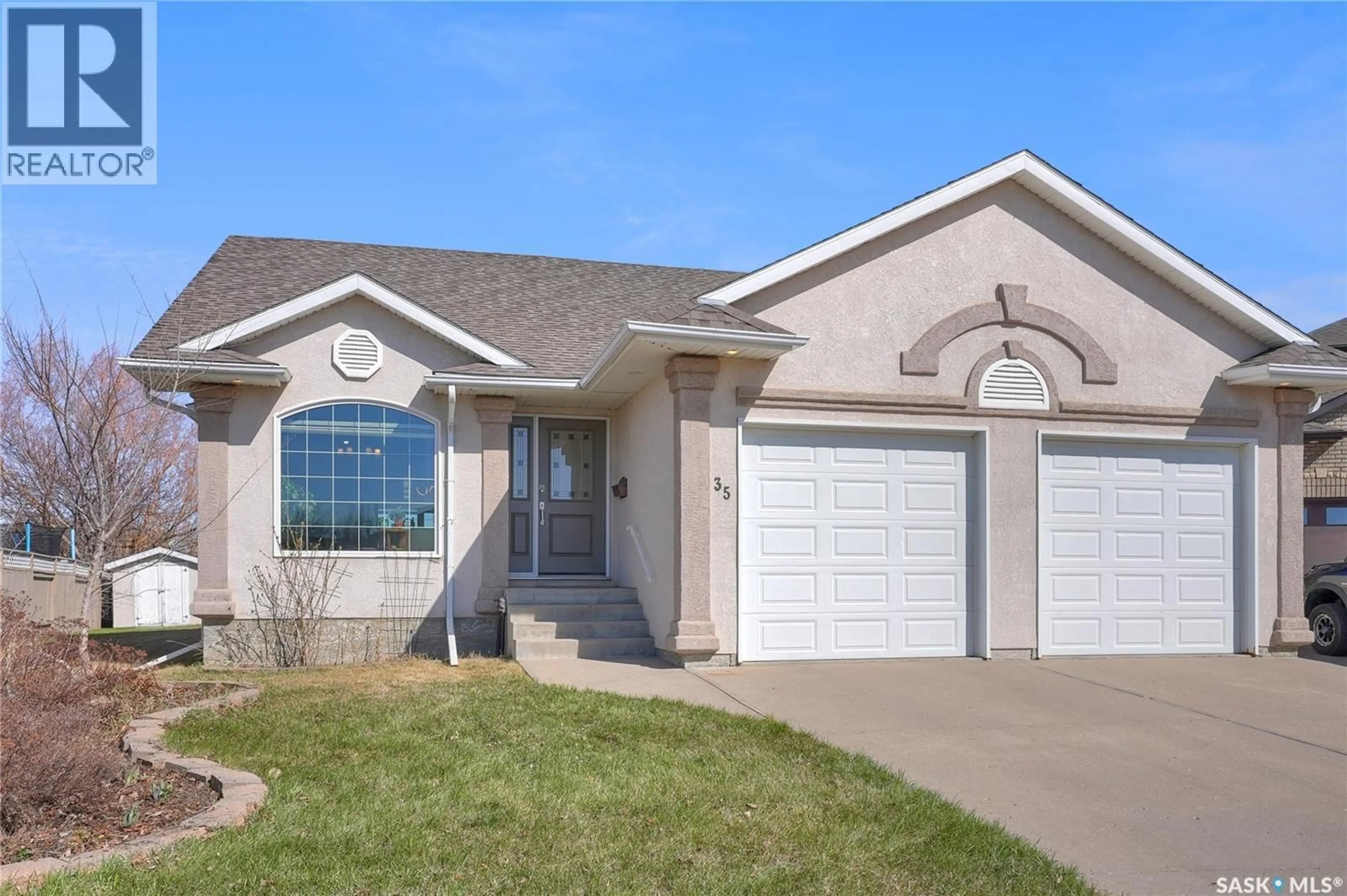 Home with vinyl exterior material, street for 35 MARIGOLD CRESCENT, Moose Jaw Saskatchewan S6J1L2