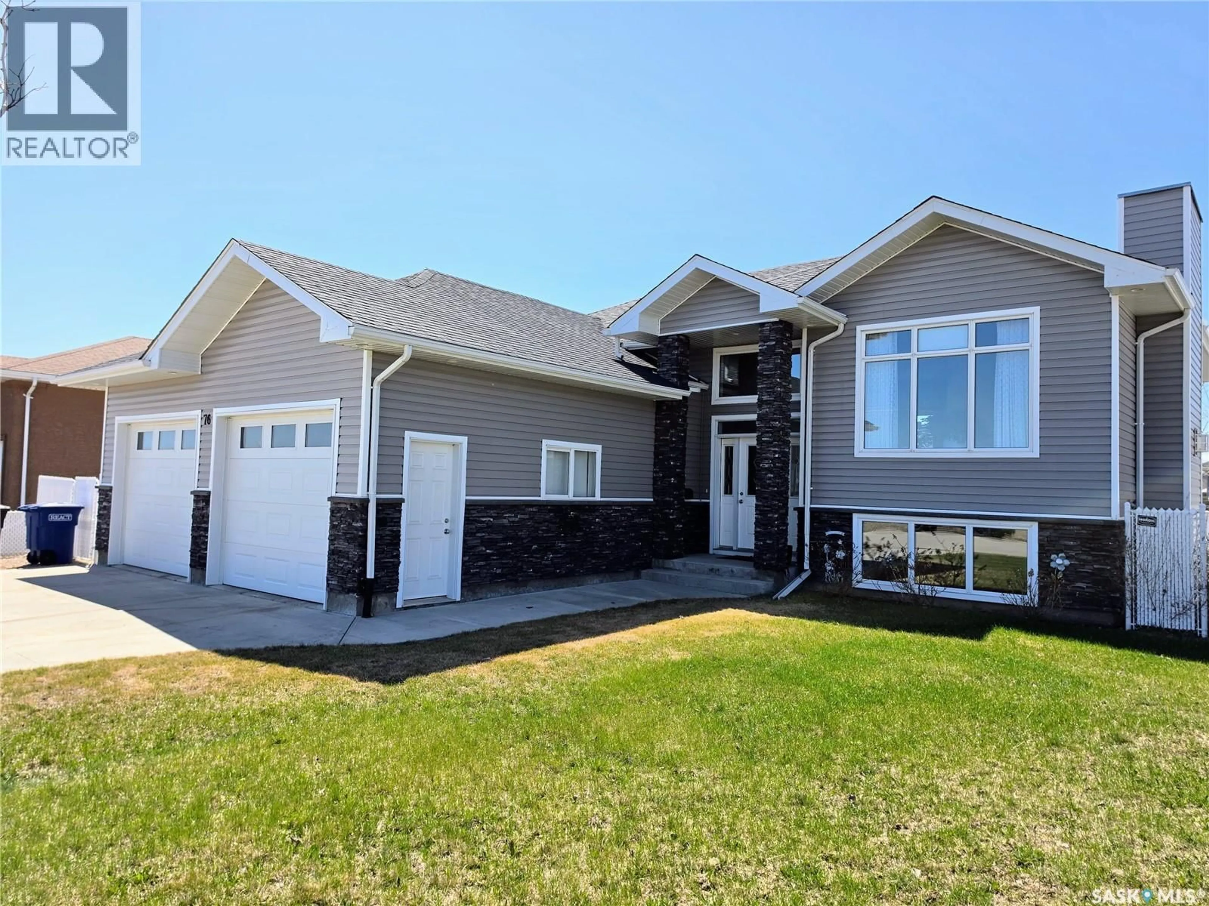 Home with vinyl exterior material, street for 76 101ST STREET, Humboldt Saskatchewan S0K2A0