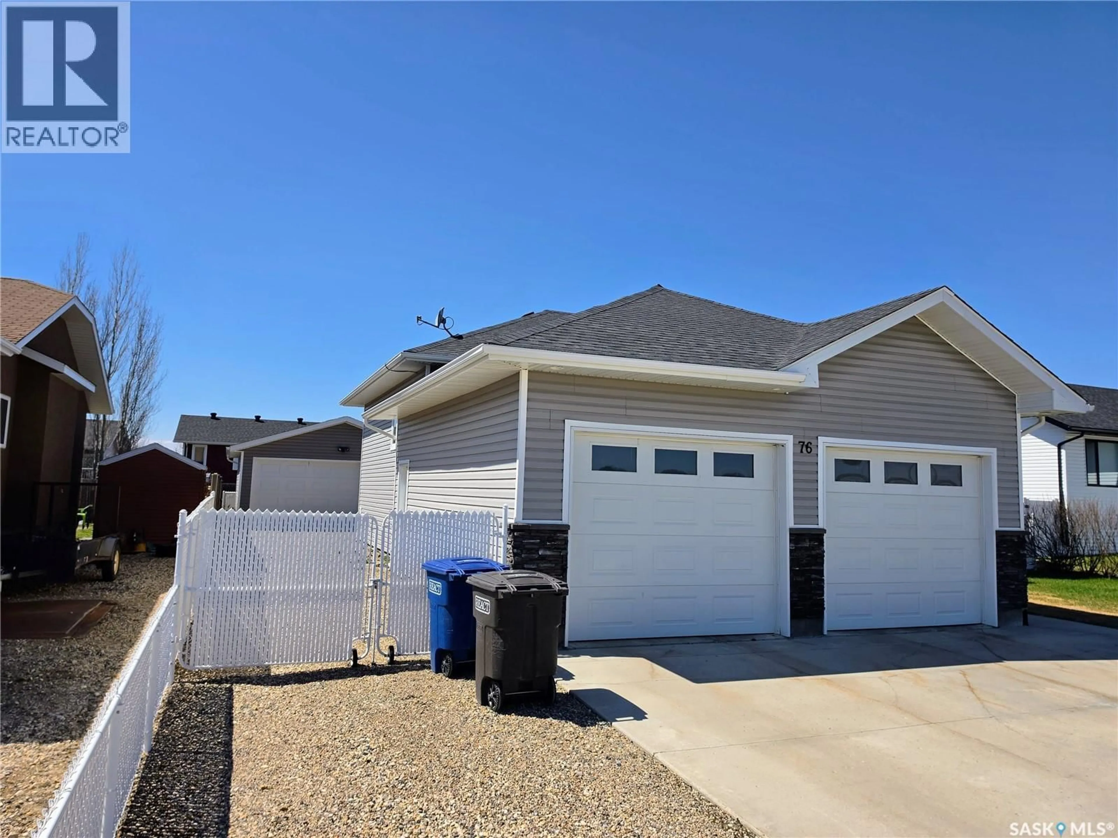Home with vinyl exterior material, street for 76 101ST STREET, Humboldt Saskatchewan S0K2A0