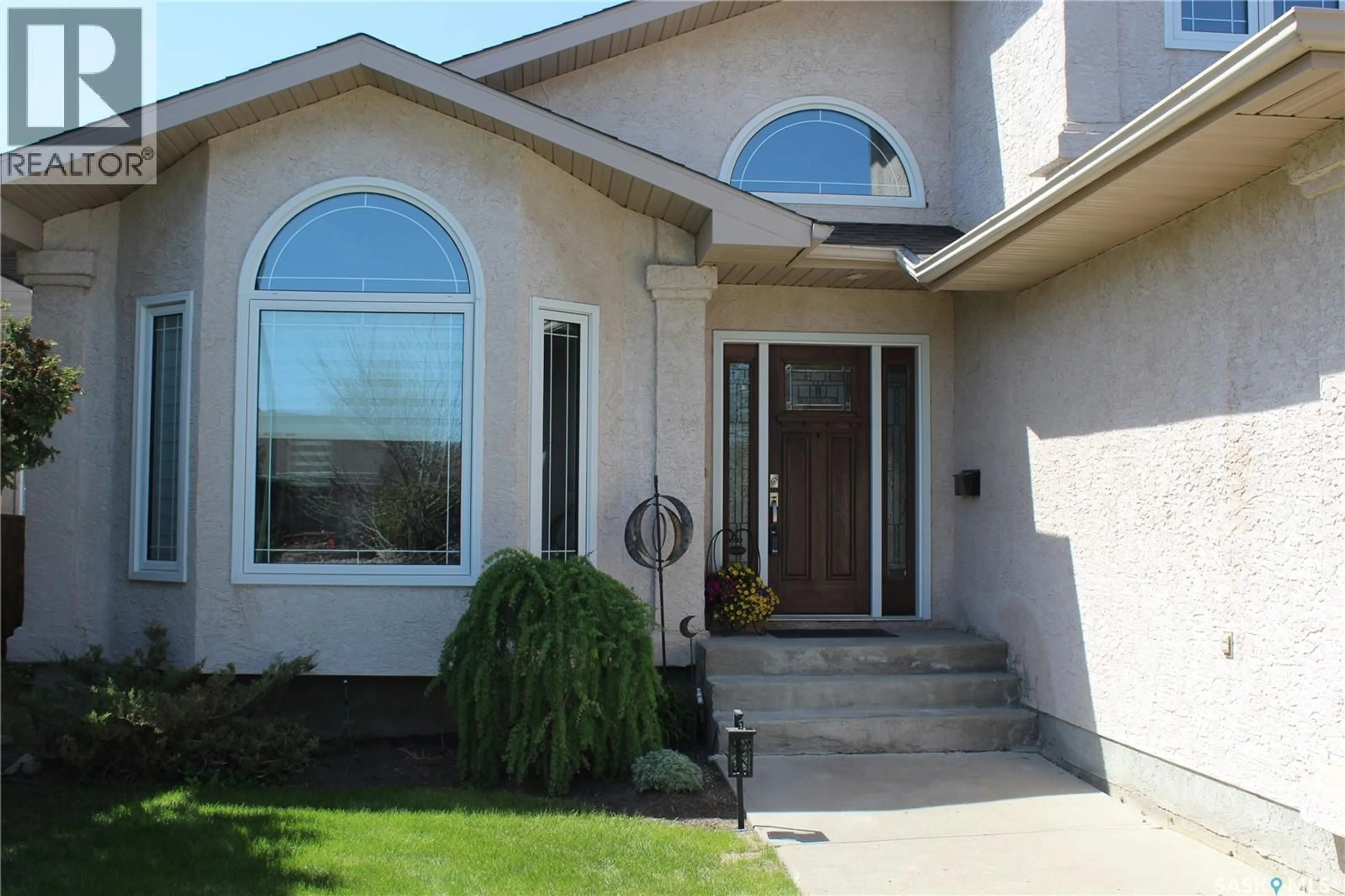 Home with vinyl exterior material, street for 3324 DIETER BAY, Regina Saskatchewan S4V2V9