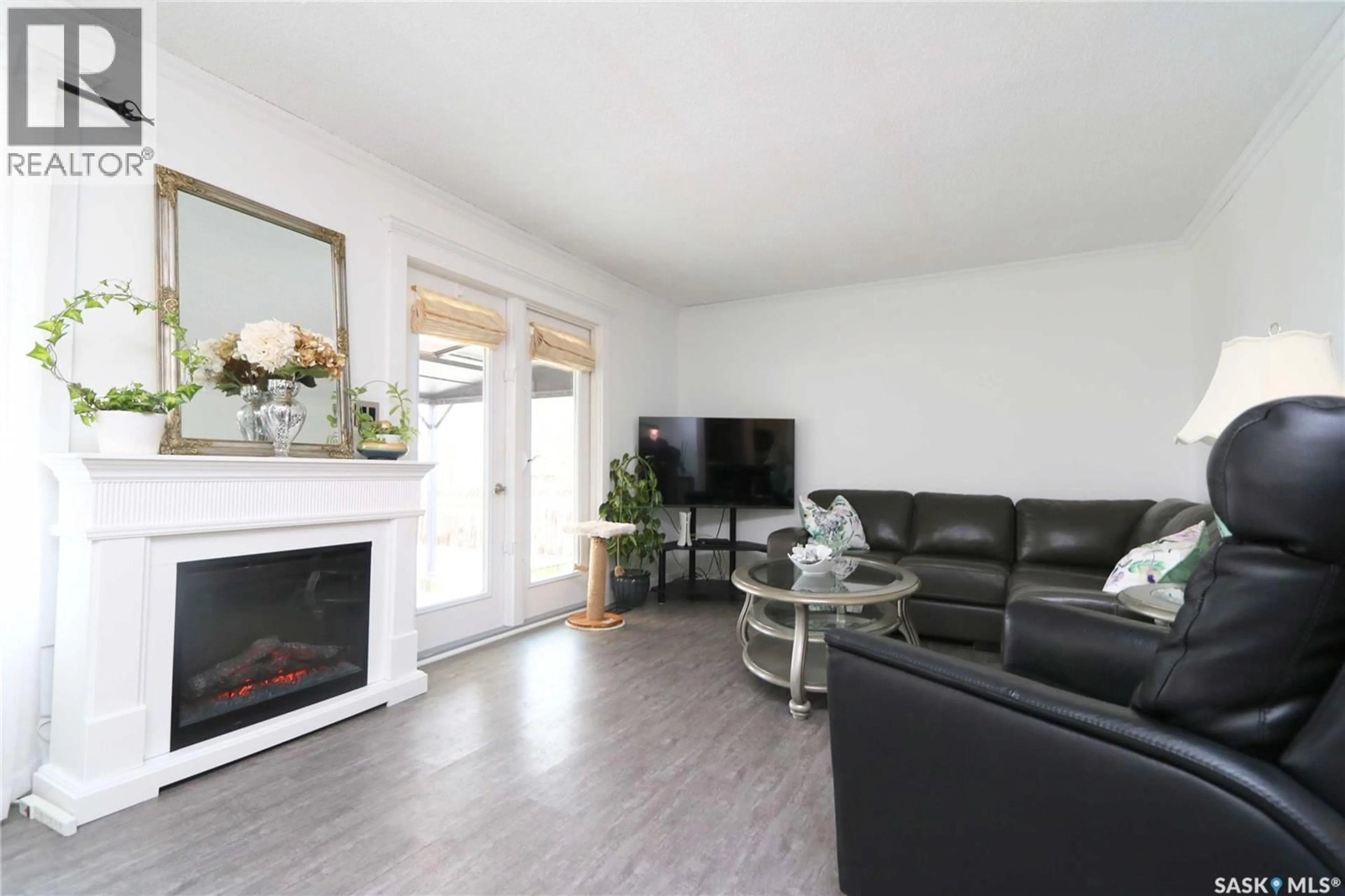 Living room with furniture, wood/laminate floor for Wallace Rm No. 243 Saskatchewan S3N2V3