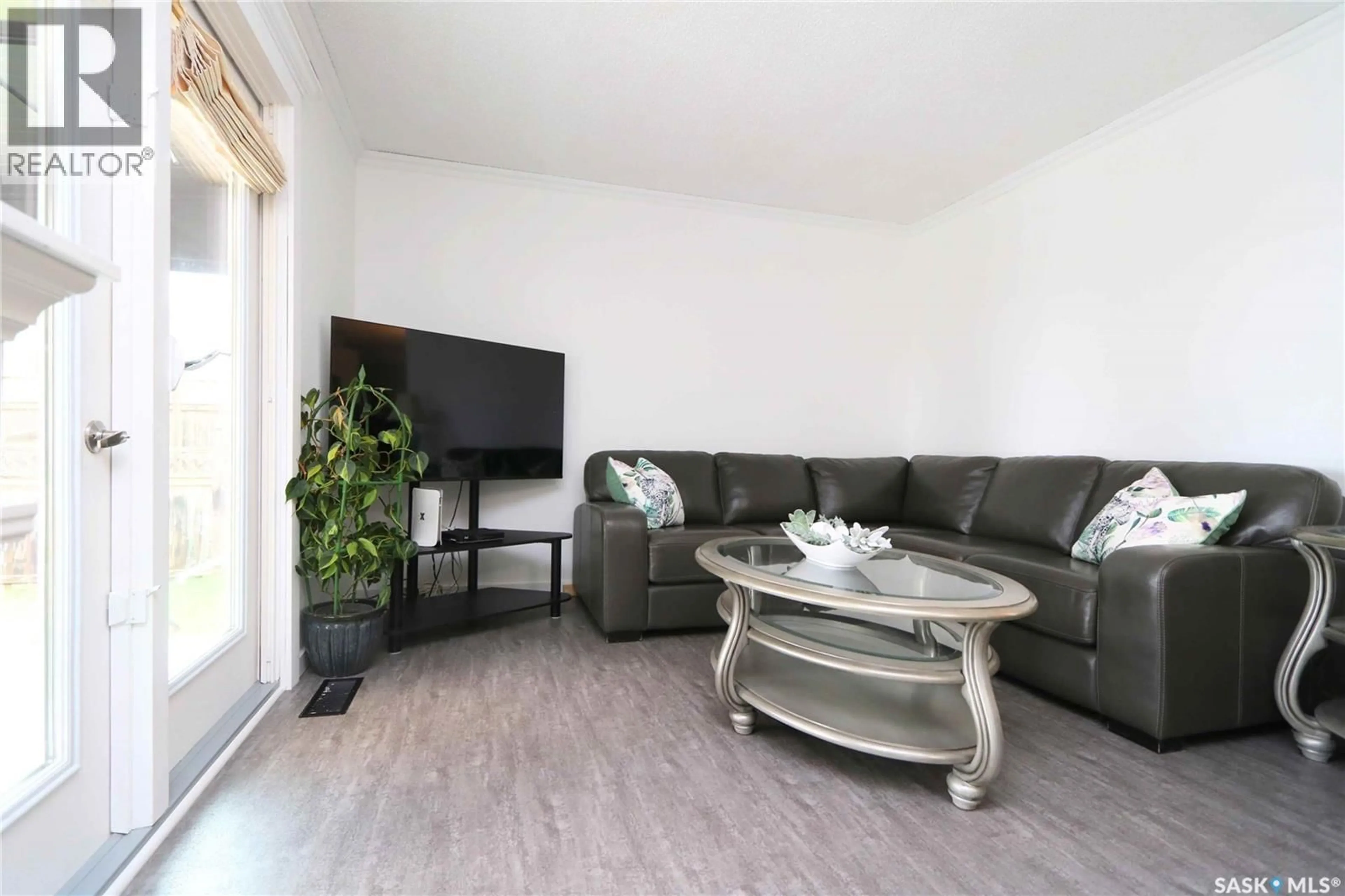 Living room with furniture, wood/laminate floor for Wallace Rm No. 243 Saskatchewan S3N2V3