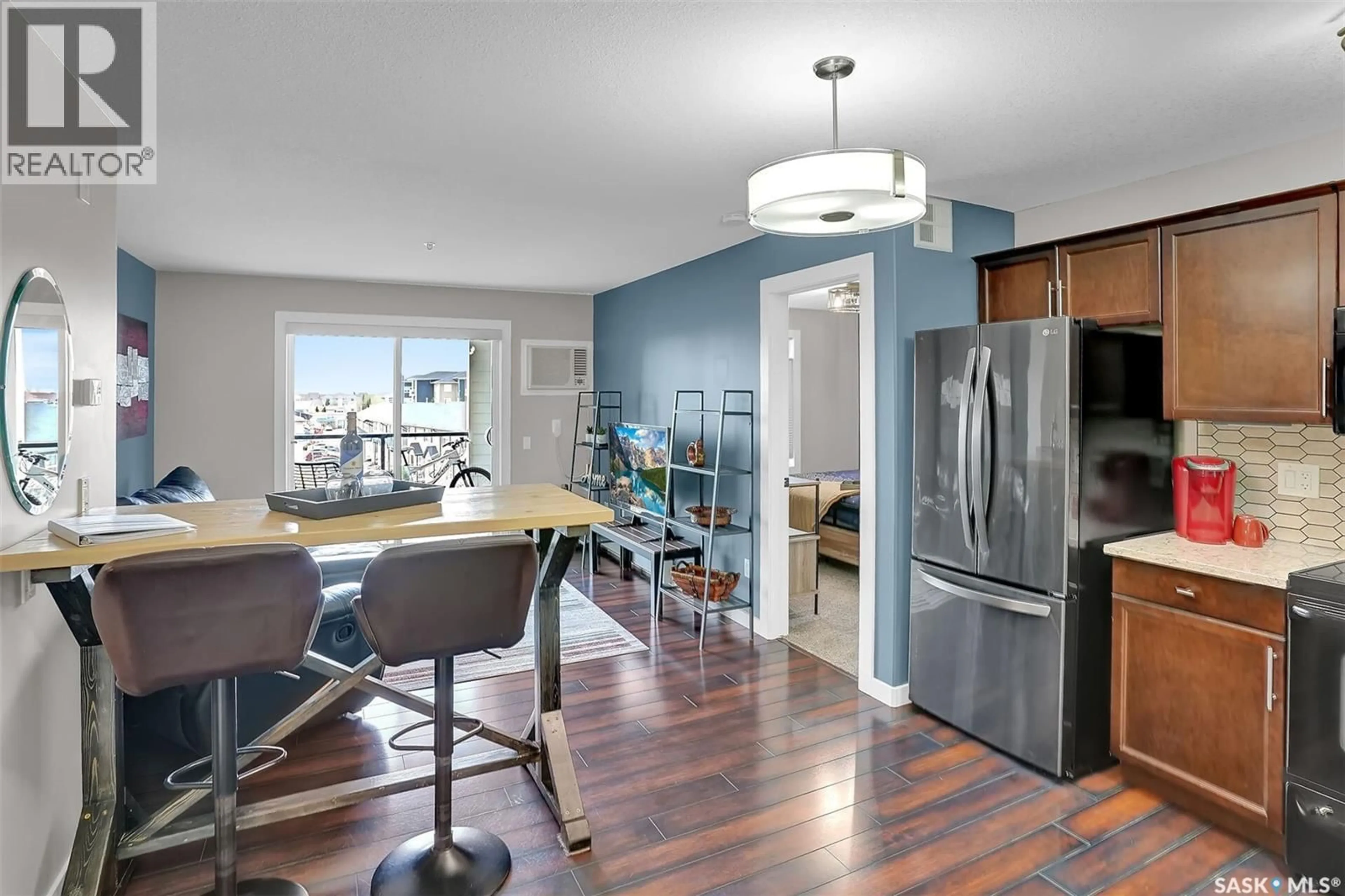 Open concept kitchen, wood/laminate floor for N - 310 E 1300 STOCKTON STREET, Regina Saskatchewan S4X0G1