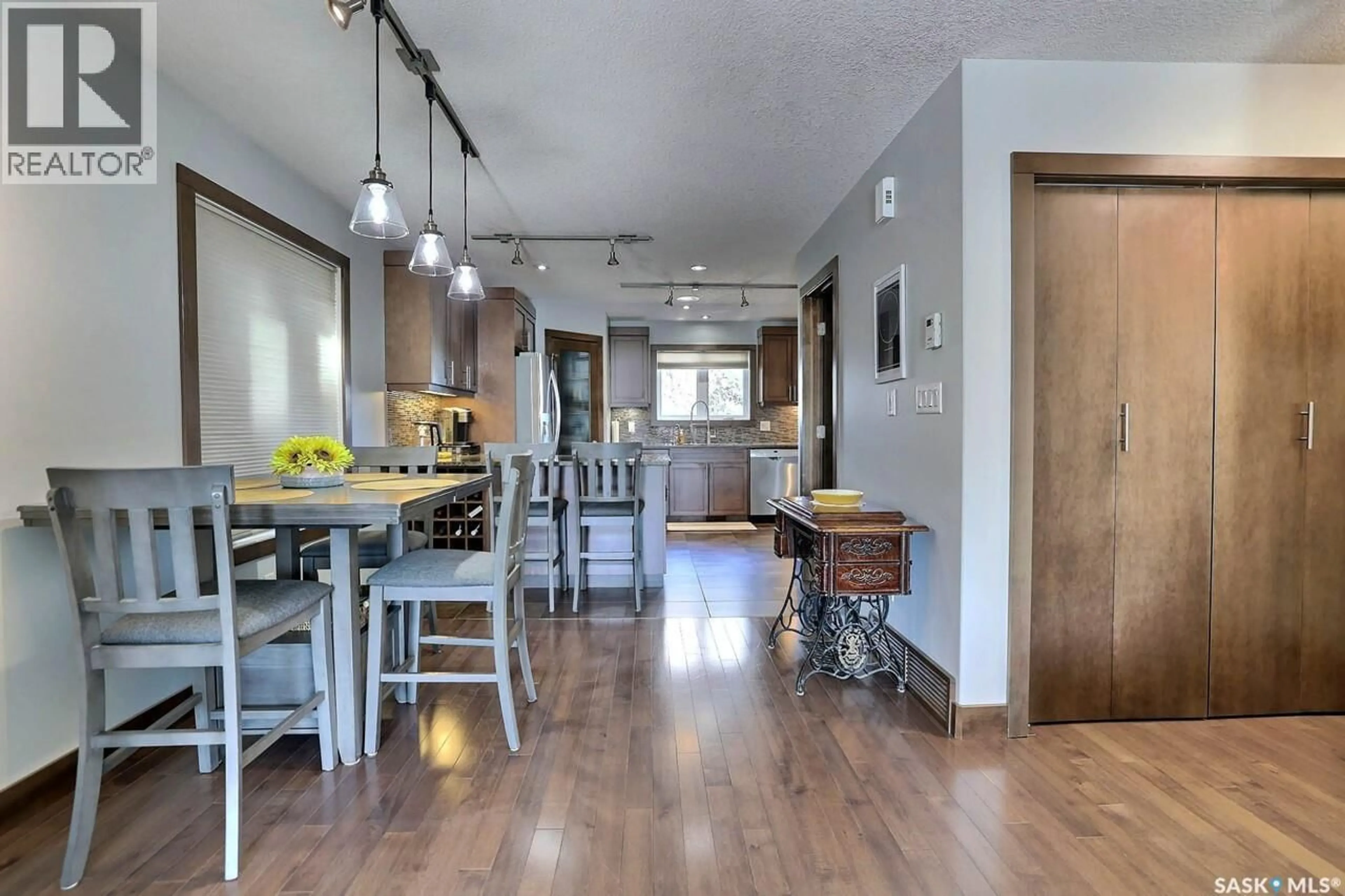 Open concept kitchen, wood/laminate floor for 1456 MCCARTHY BOULEVARD, Regina Saskatchewan S4T1A4