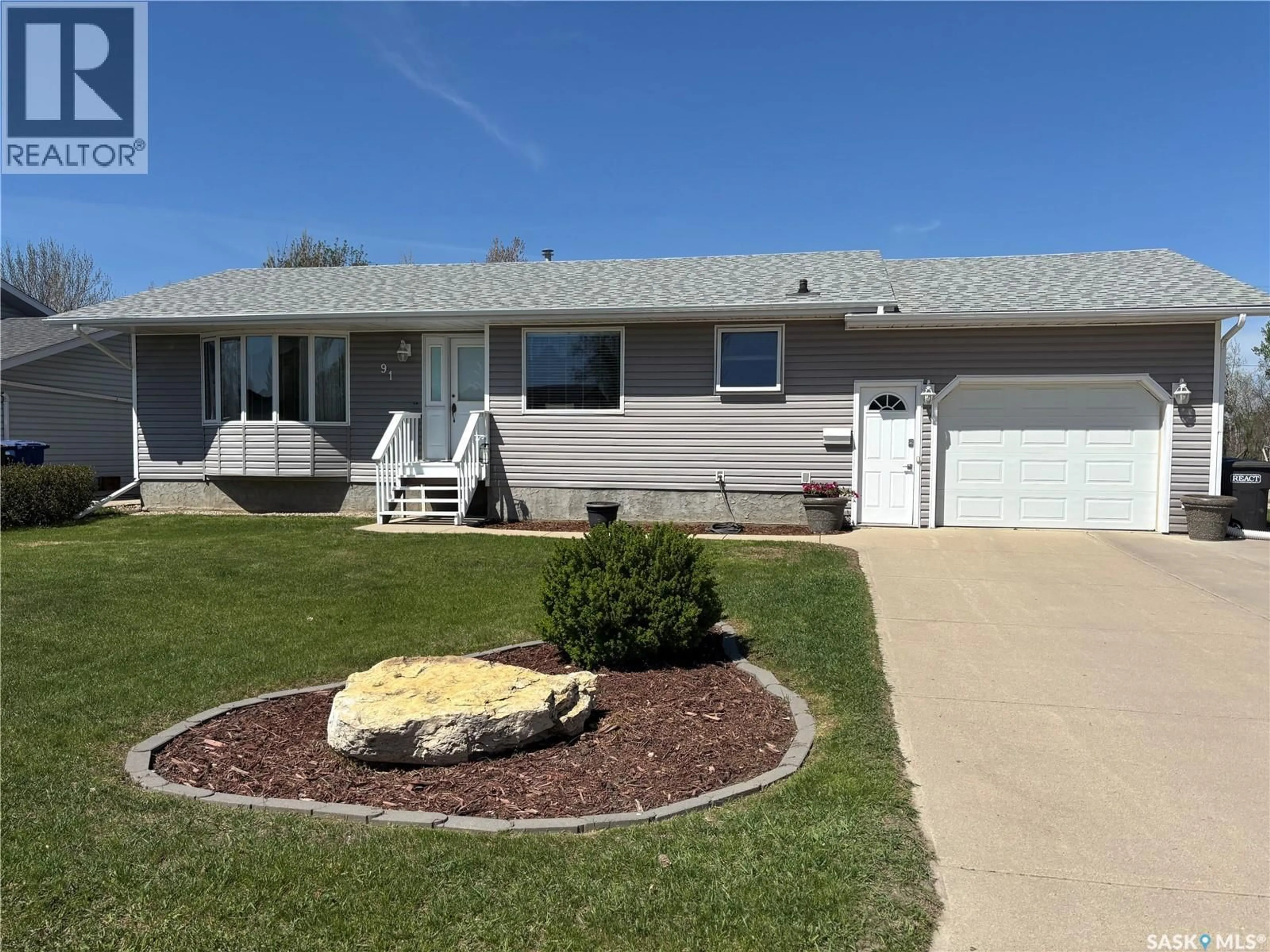 Home with vinyl exterior material, street for 91 2ND AVENUE, Humboldt Saskatchewan S0K2A0