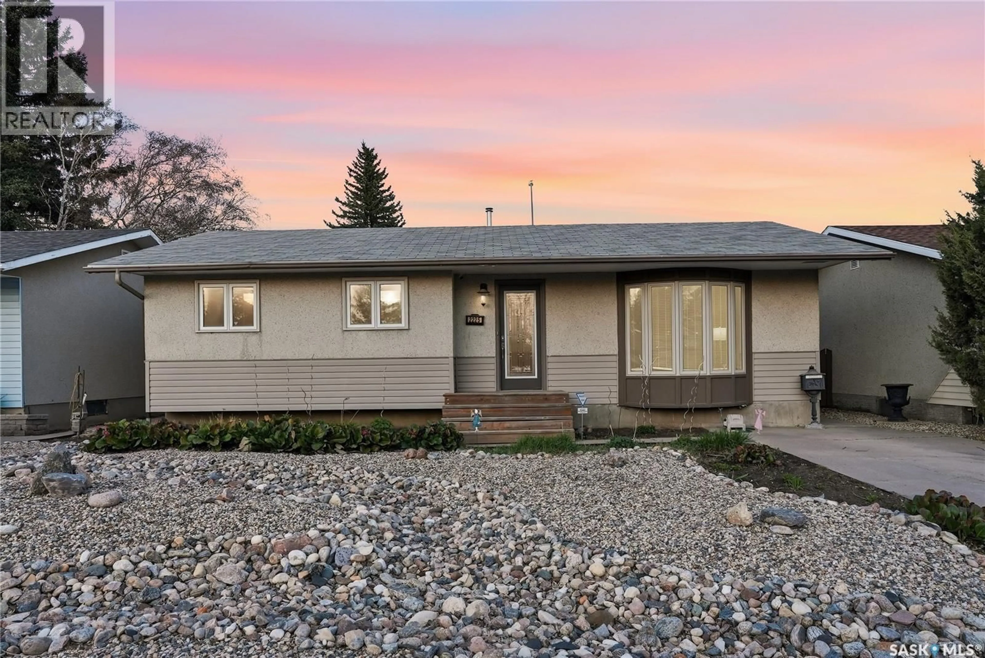 Home with vinyl exterior material, street for 2225 EASTHILL, Saskatoon Saskatchewan S7J3E1