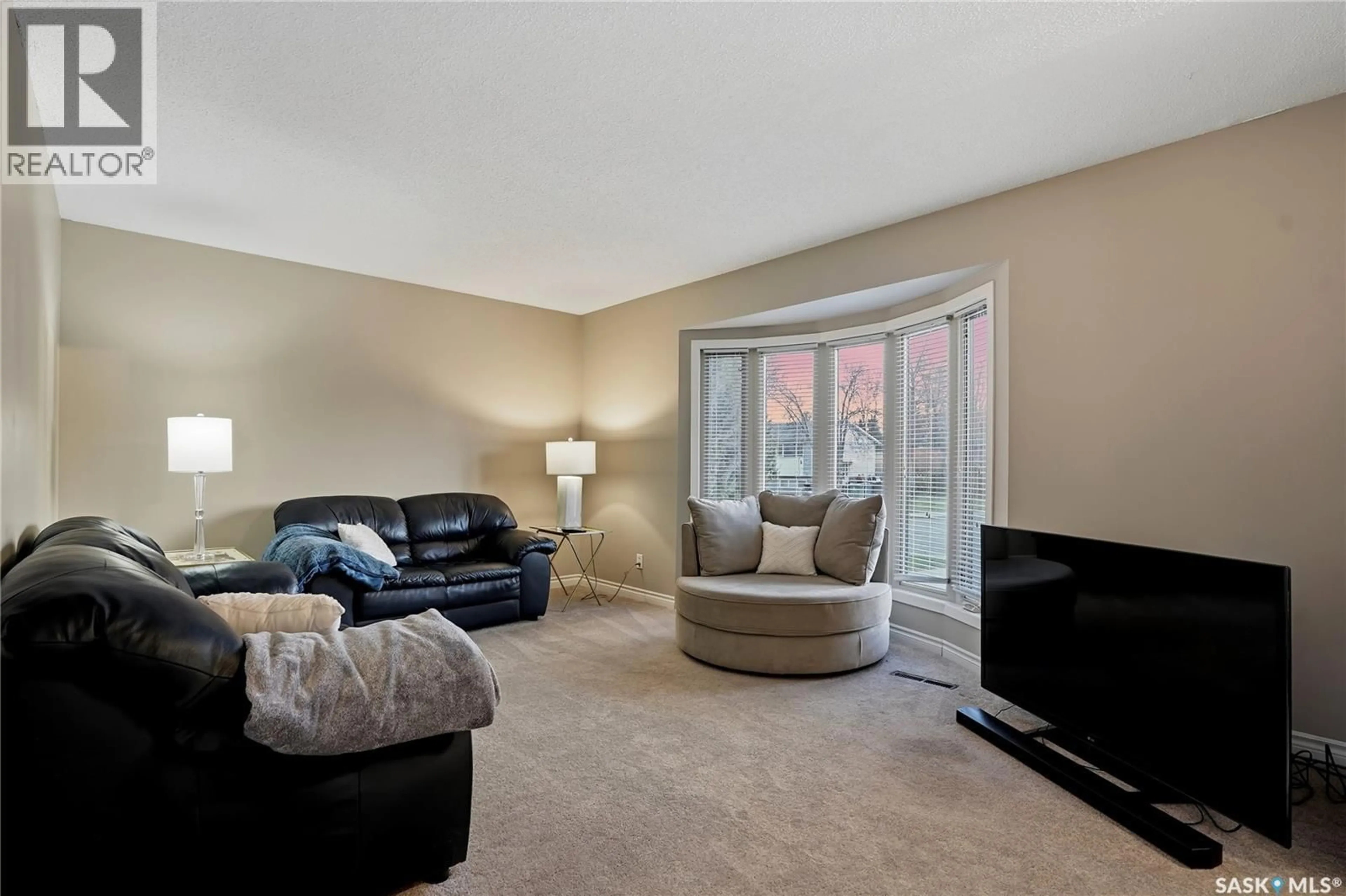 Living room with furniture, carpet floor for 2225 EASTHILL, Saskatoon Saskatchewan S7J3E1