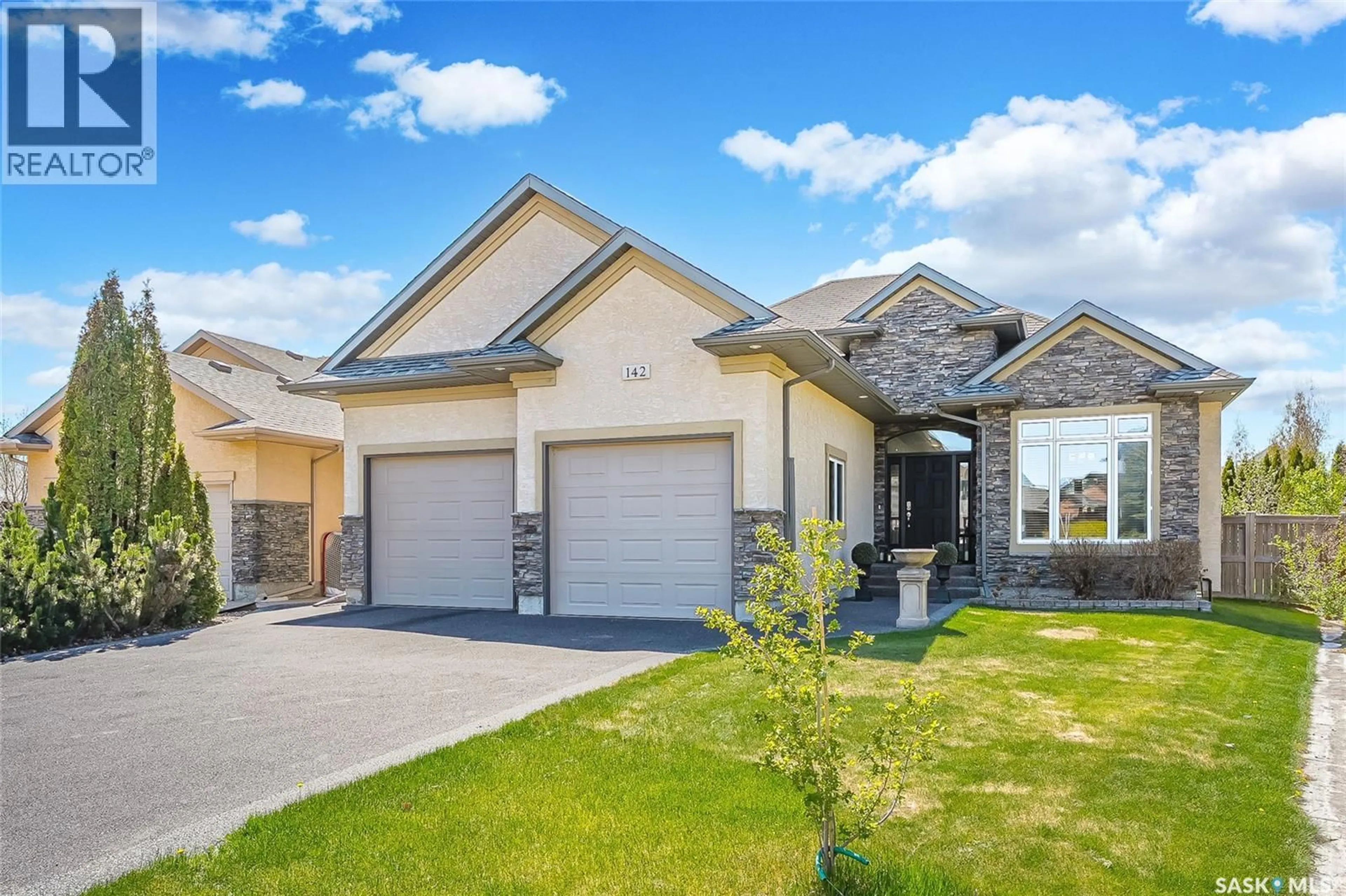 Home with vinyl exterior material, street for 142 ASSALY STREET, Saskatoon Saskatchewan S7T0E4