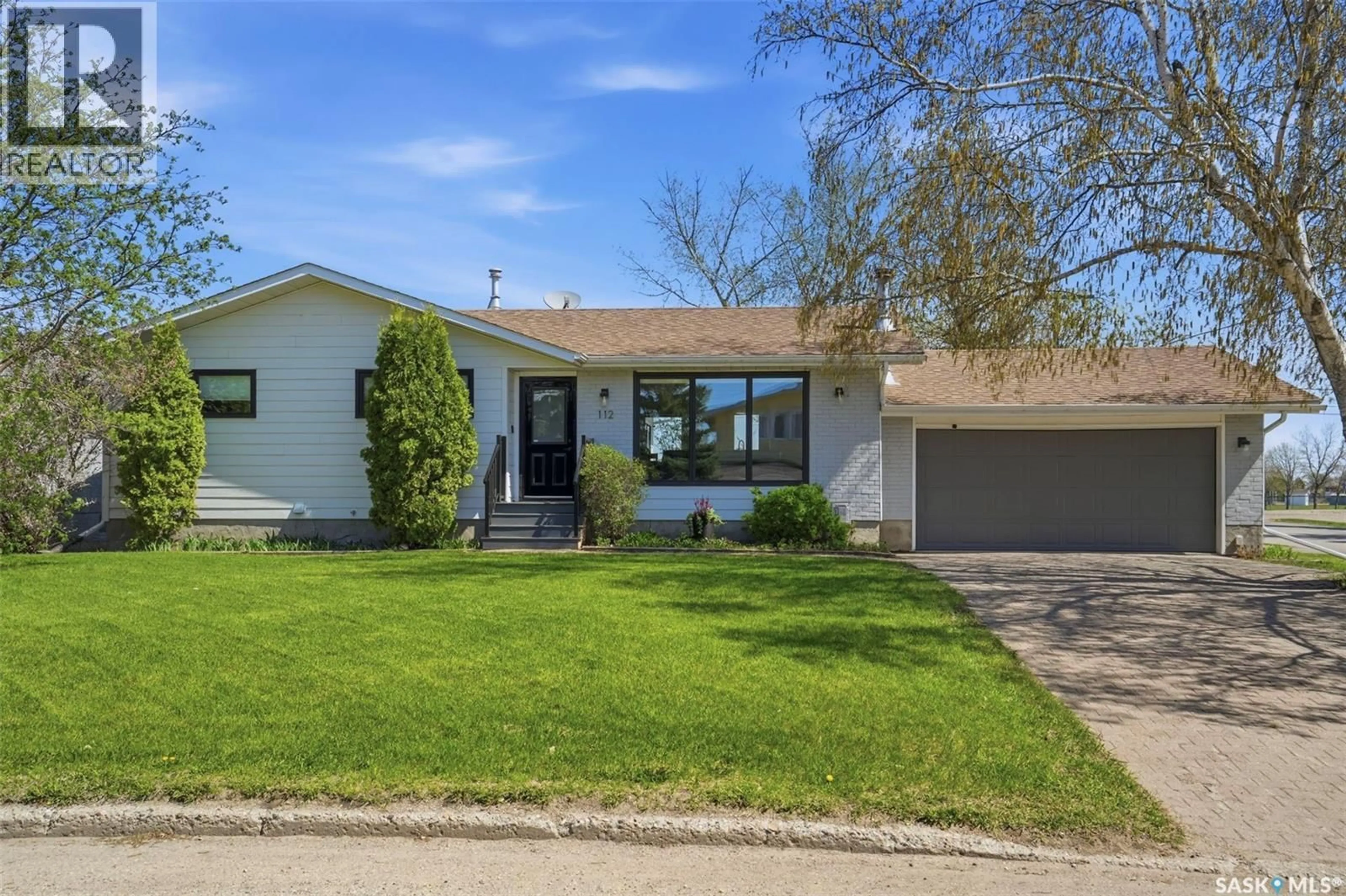 Home with vinyl exterior material, street for 112 8TH AVENUE, Watrous Saskatchewan S0K4T0