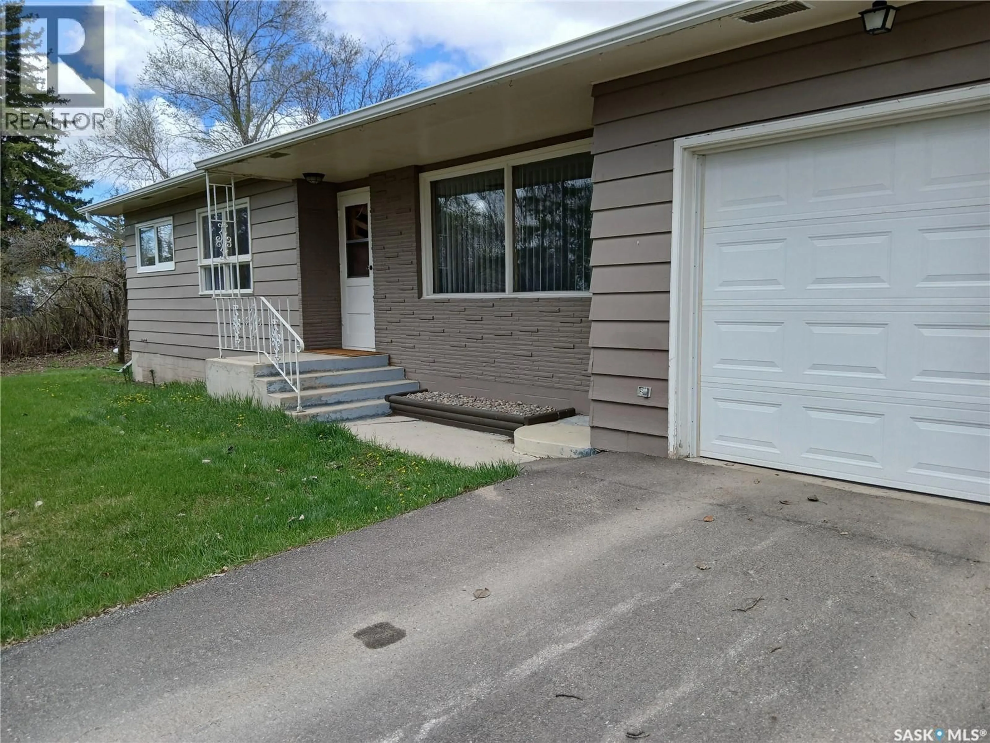 Home with vinyl exterior material, street for 604 KING STREET, Imperial Saskatchewan S0G2J0