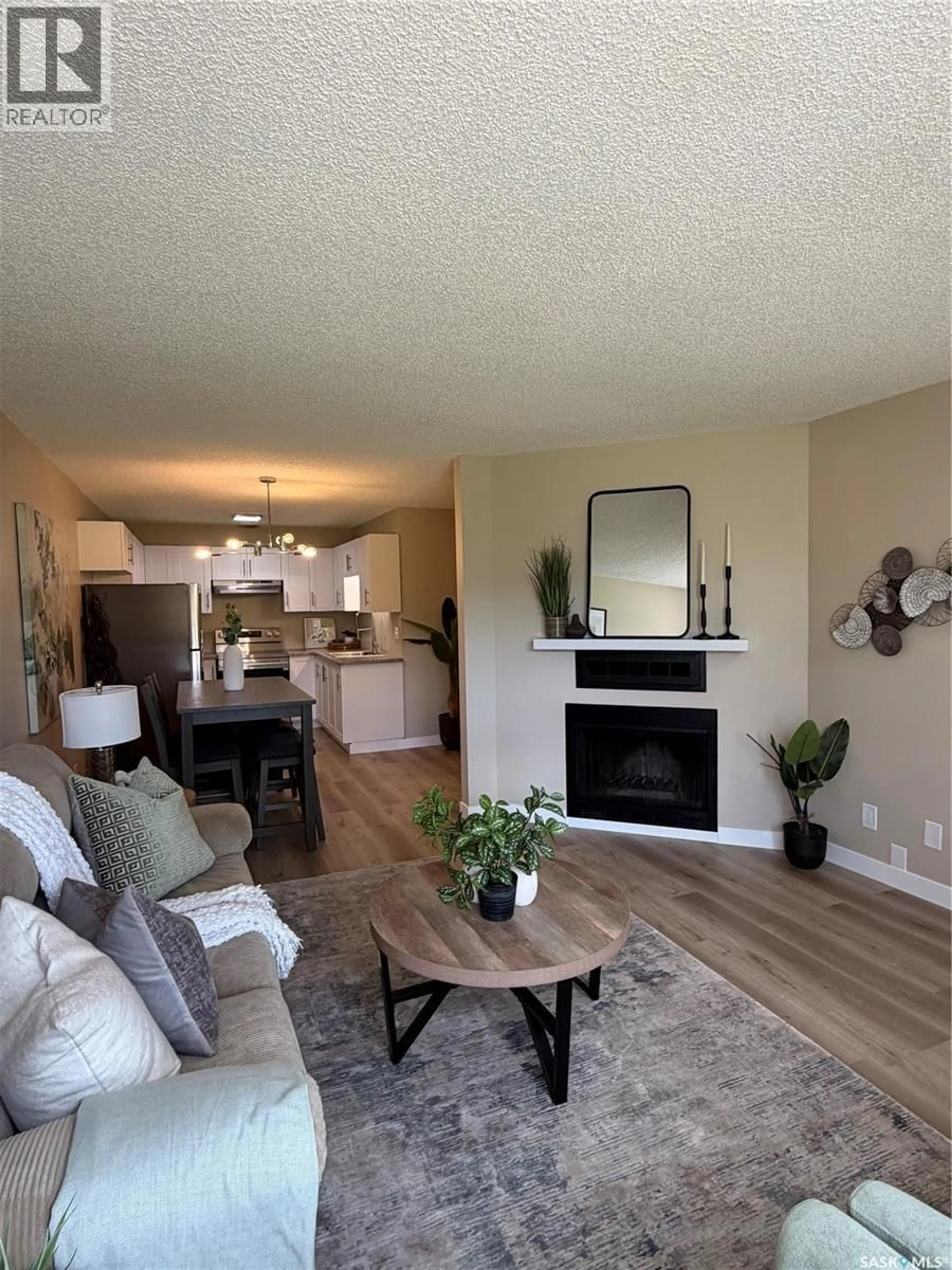Living room with furniture, wood/laminate floor for 358 CEDAR MEADOW DRIVE, Regina Saskatchewan S4X3E6